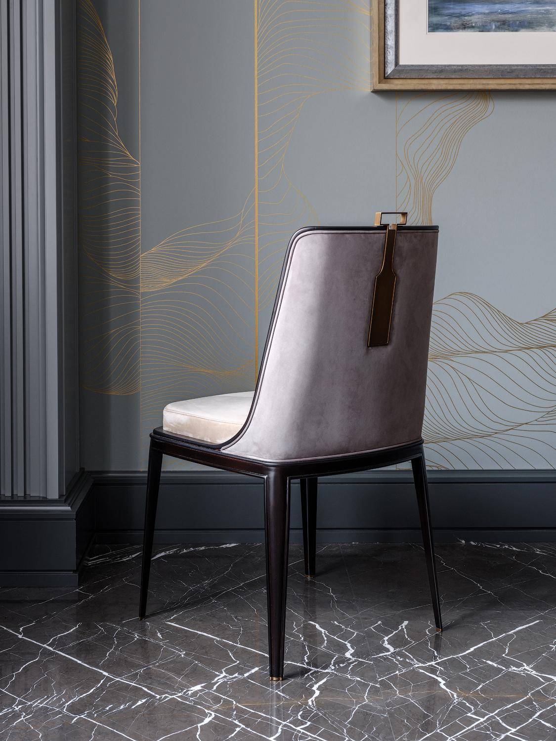 The Metallah modern dining chair has an unusual cube-shaped construction and a trapezoid back. The chair back and body are formed from shaped composite walnut hardwood, while the legs taper elegantly to the floor. 

Two options are available: with
