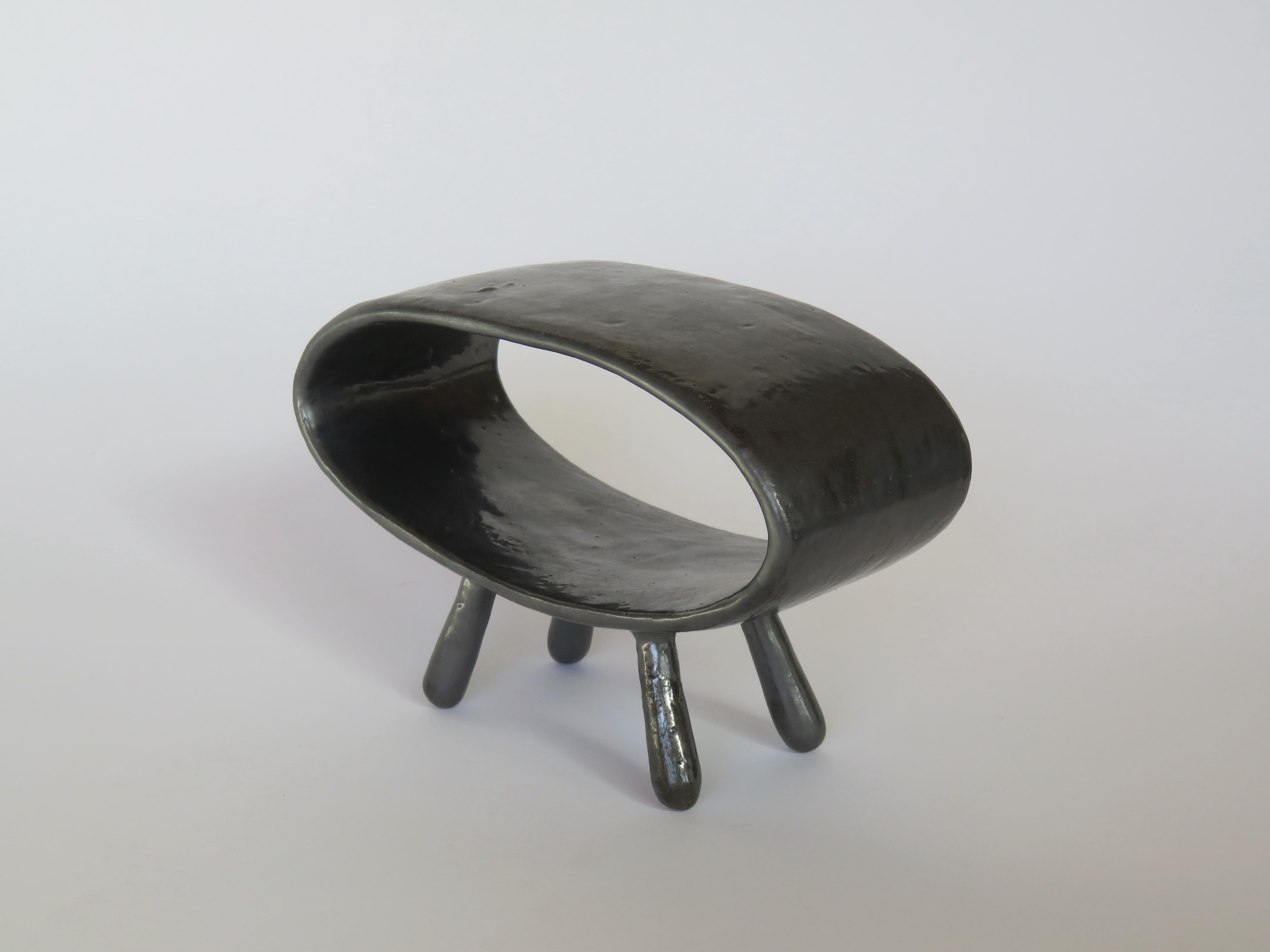 A hollow pointed oval sculpture on 4 legs. Part of a new series of related pieces, a sculptural 
