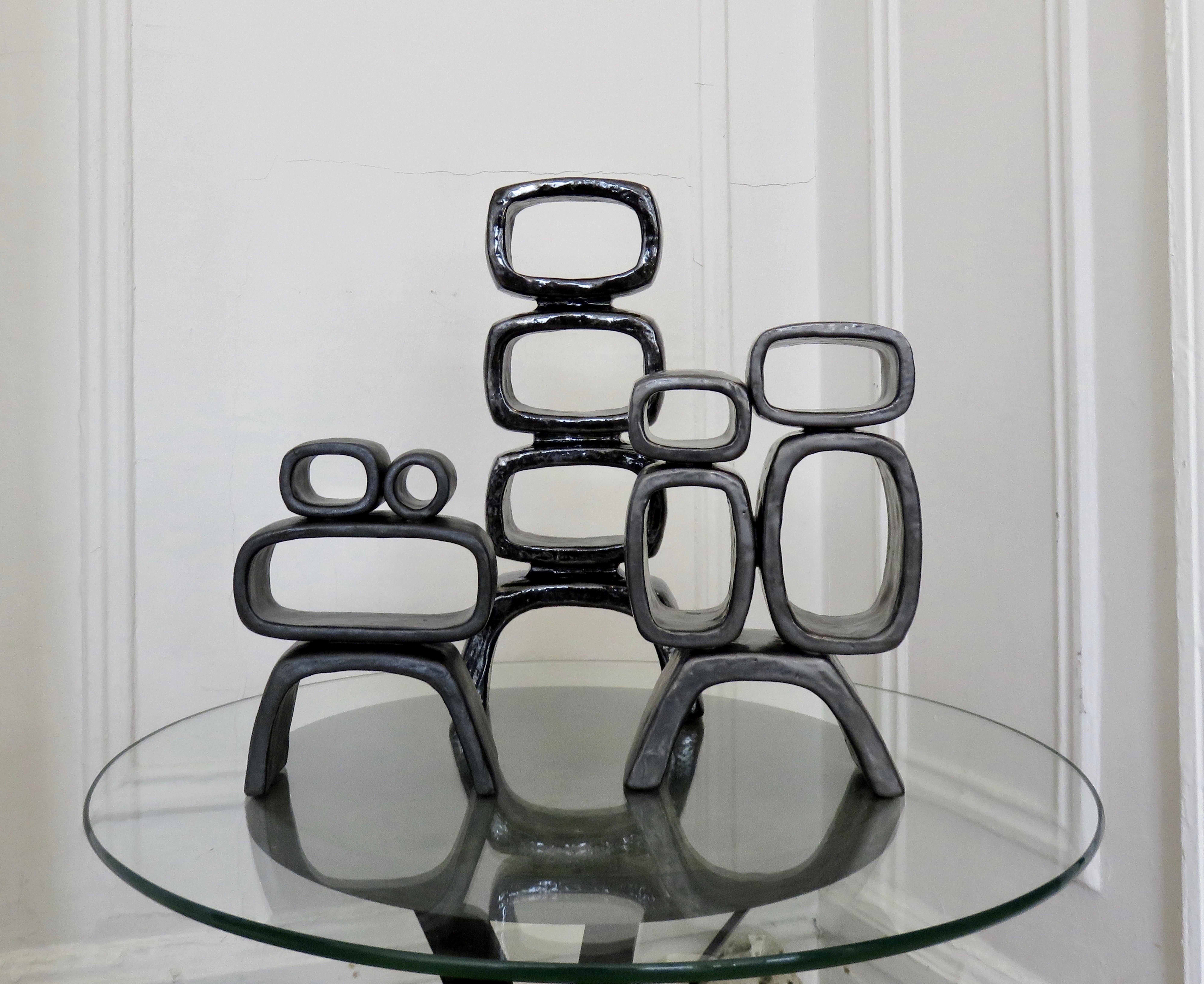 Metallic Black Hand-Built Ceramic Sculpture with Hollow Rings on Angled Legs 12