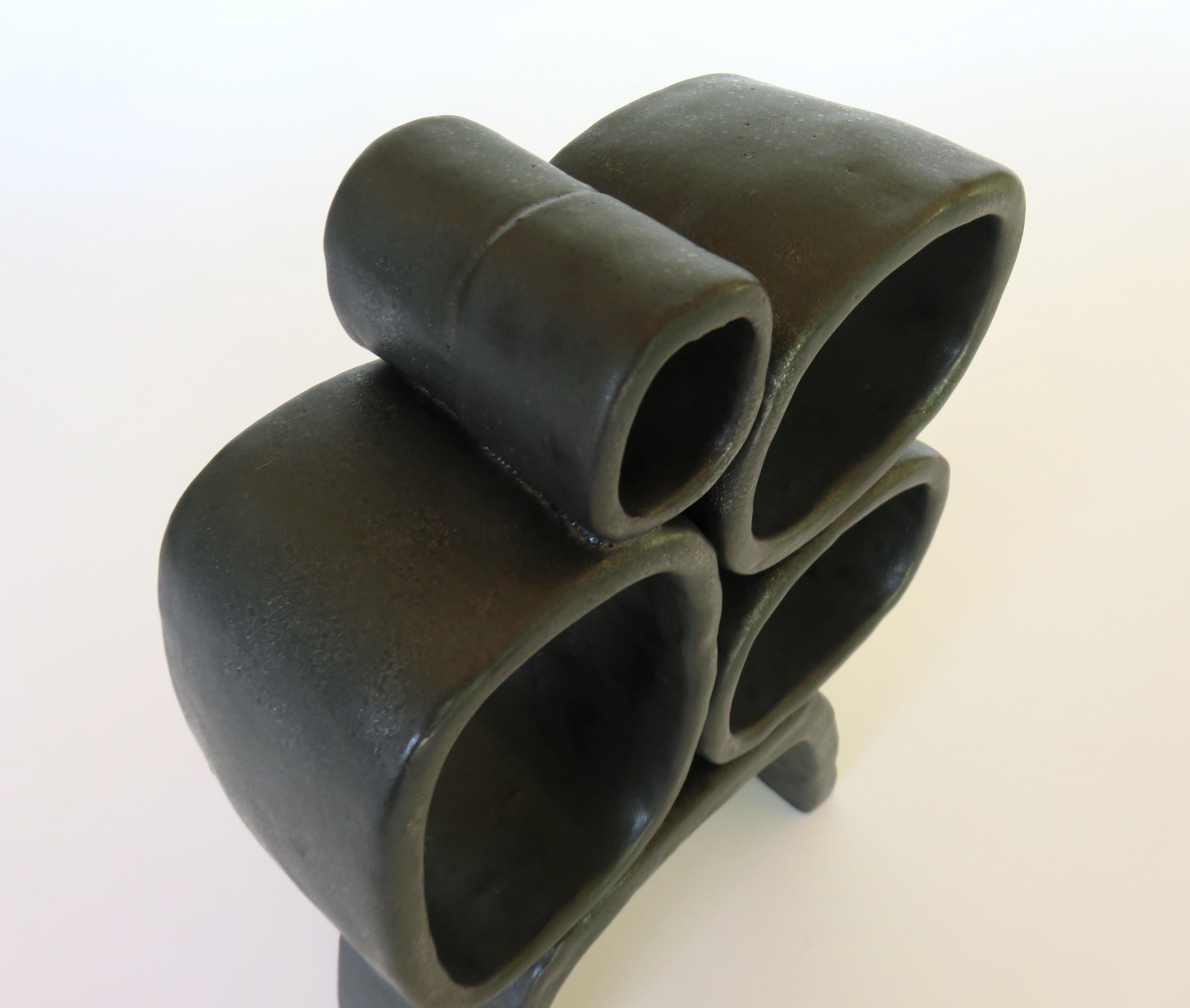 Contemporary Metallic Black Hand-Built Ceramic Sculpture with Hollow Rings on Angled Legs