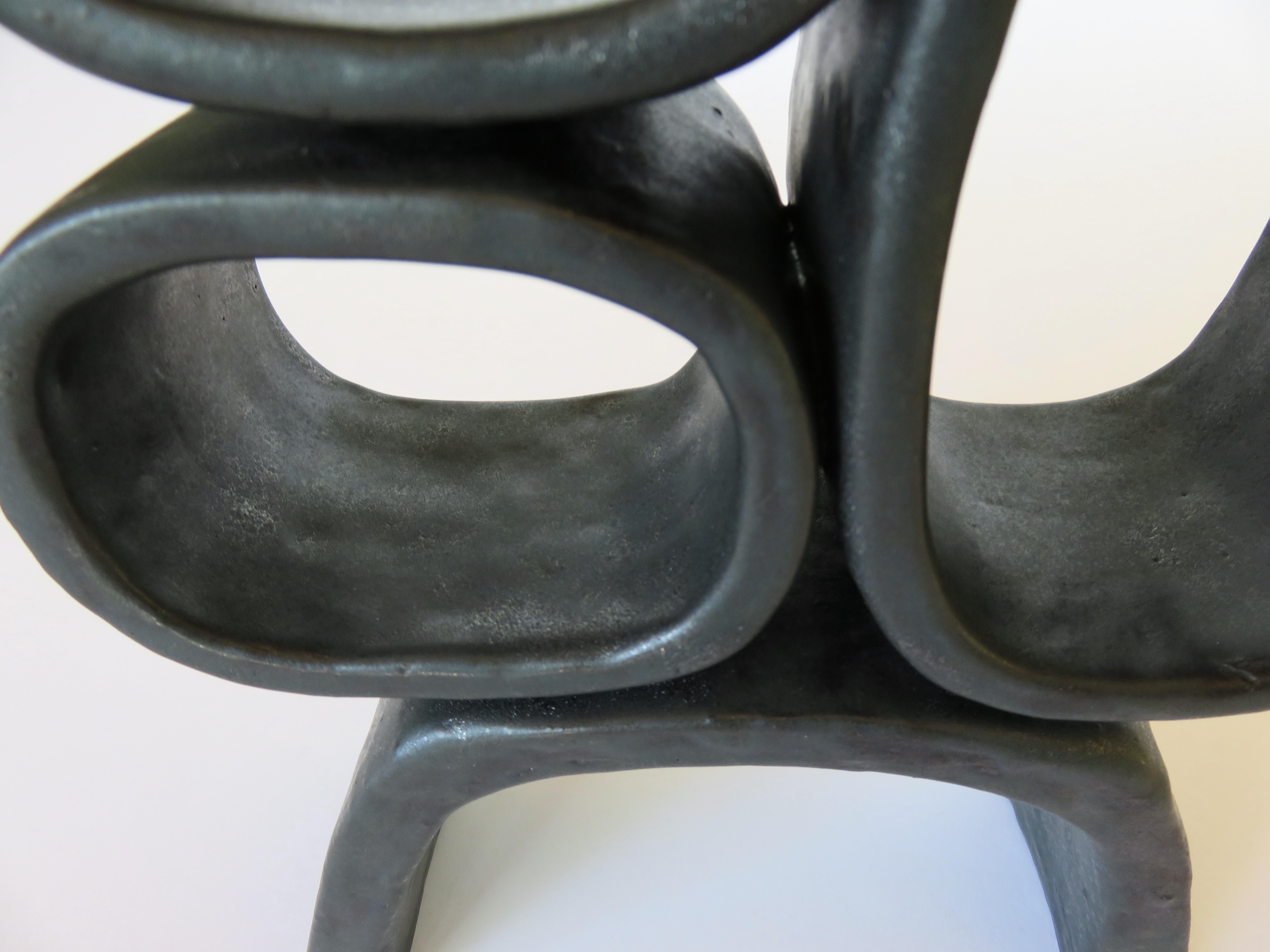 Metallic Black Hand-Built Ceramic Sculpture with Hollow Rings on Angled Legs 1