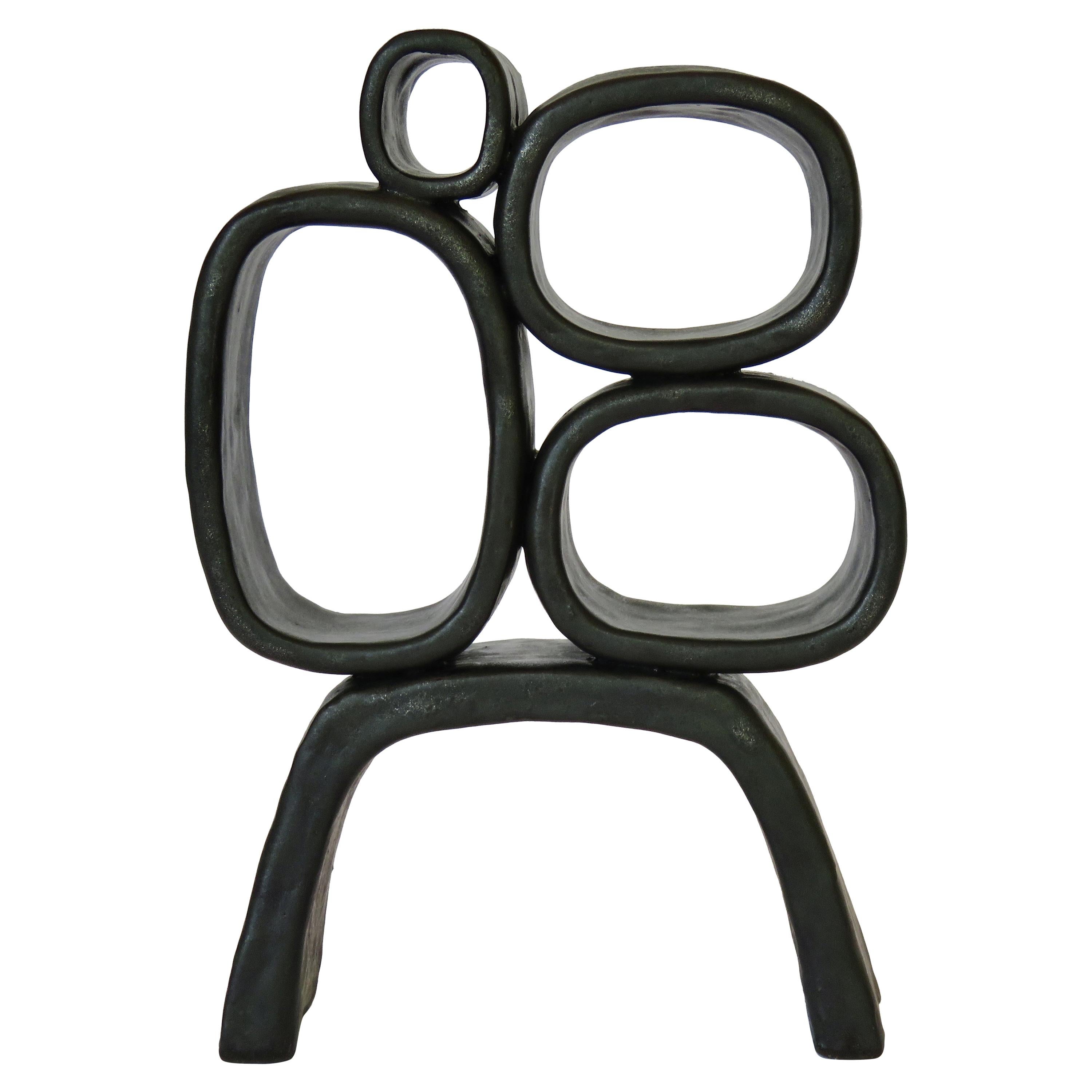 Metallic Black Hand-Built Ceramic Sculpture with Hollow Rings on Angled Legs