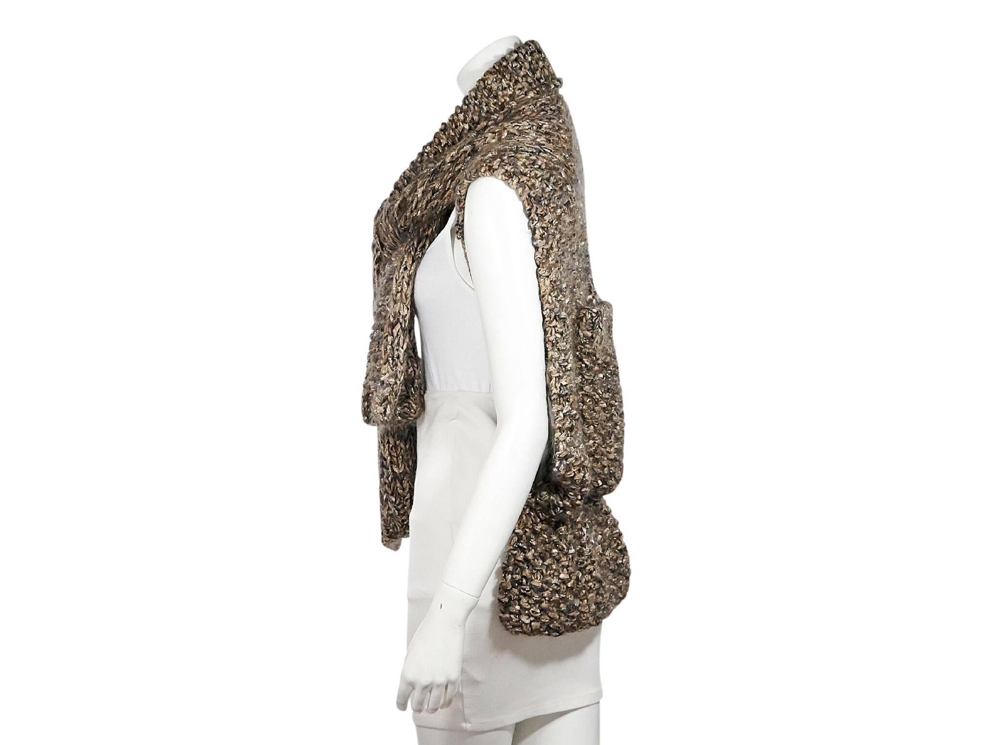 Product details:  Metallic beige knit vest by Chanel.  Attached hood.  30.5