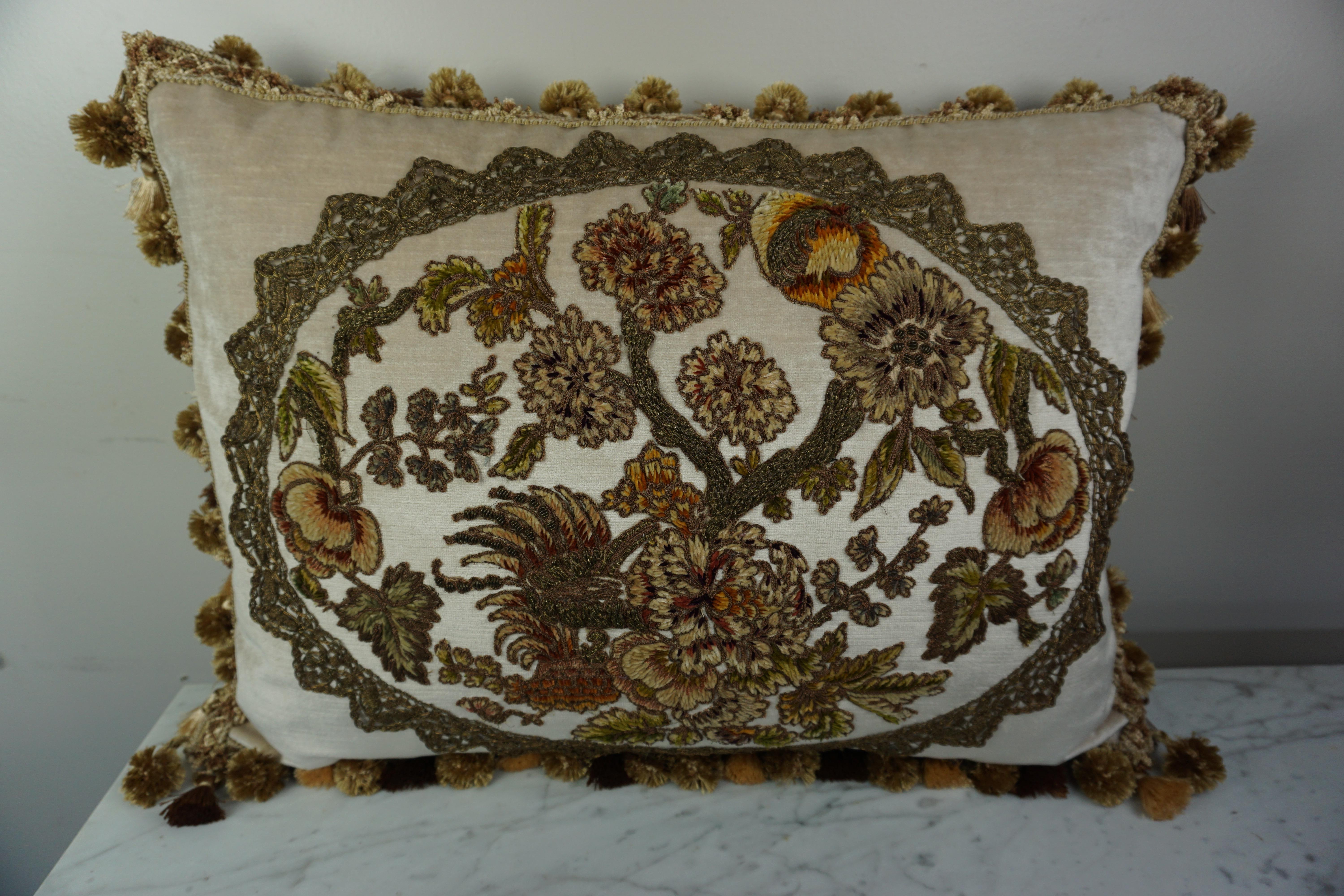 Custom pillow designed by Melissa Levinson using 19th century handmade French metallic and chenille appliques combined with contemporary velvet front and back. 19th century metallic handmade trim surrounds the antique floral applique. The pillow is