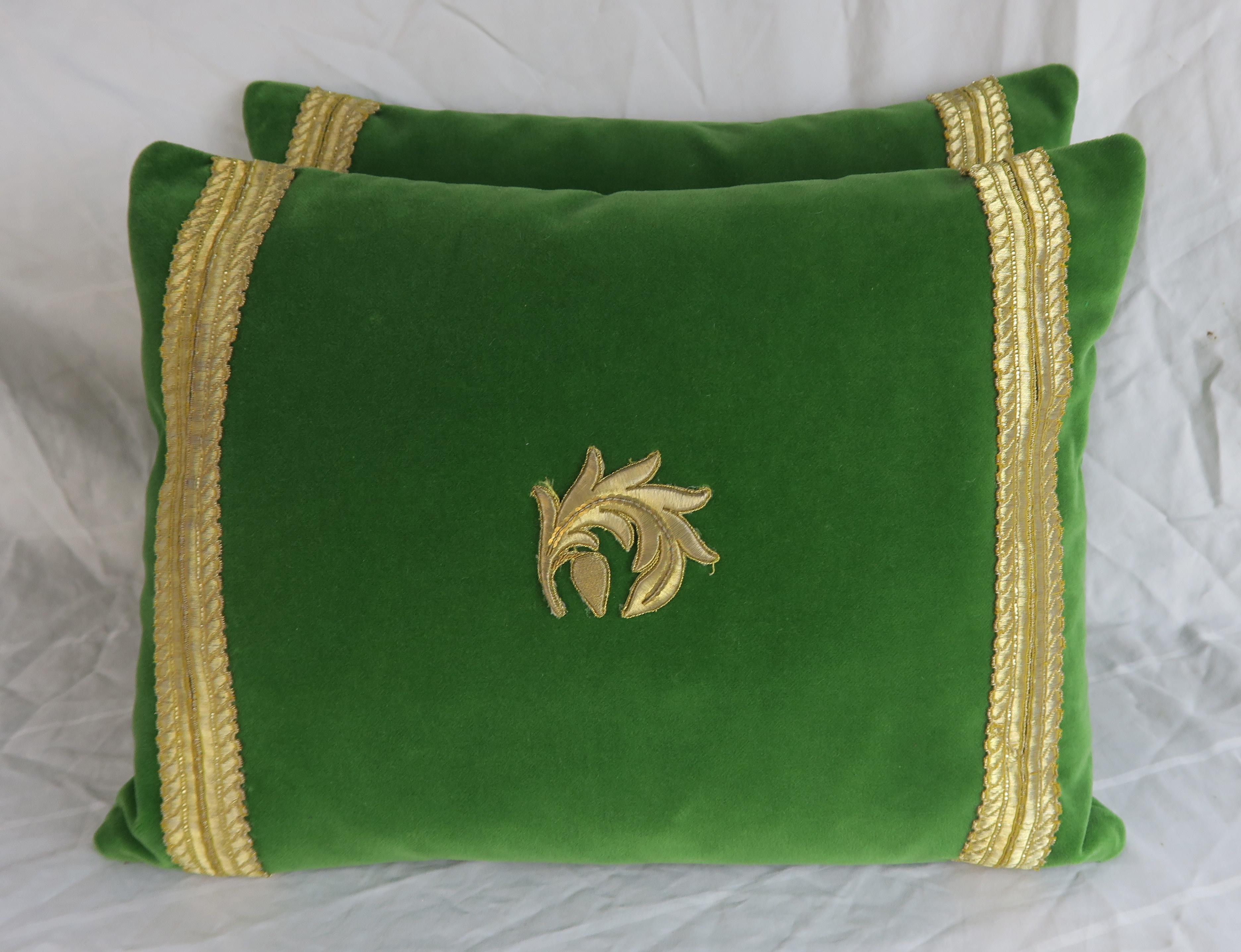 Pair of custom pillows made with metallic gold appliquéd silk velvet with gold metallic trim. Down inserts, zipper closures.