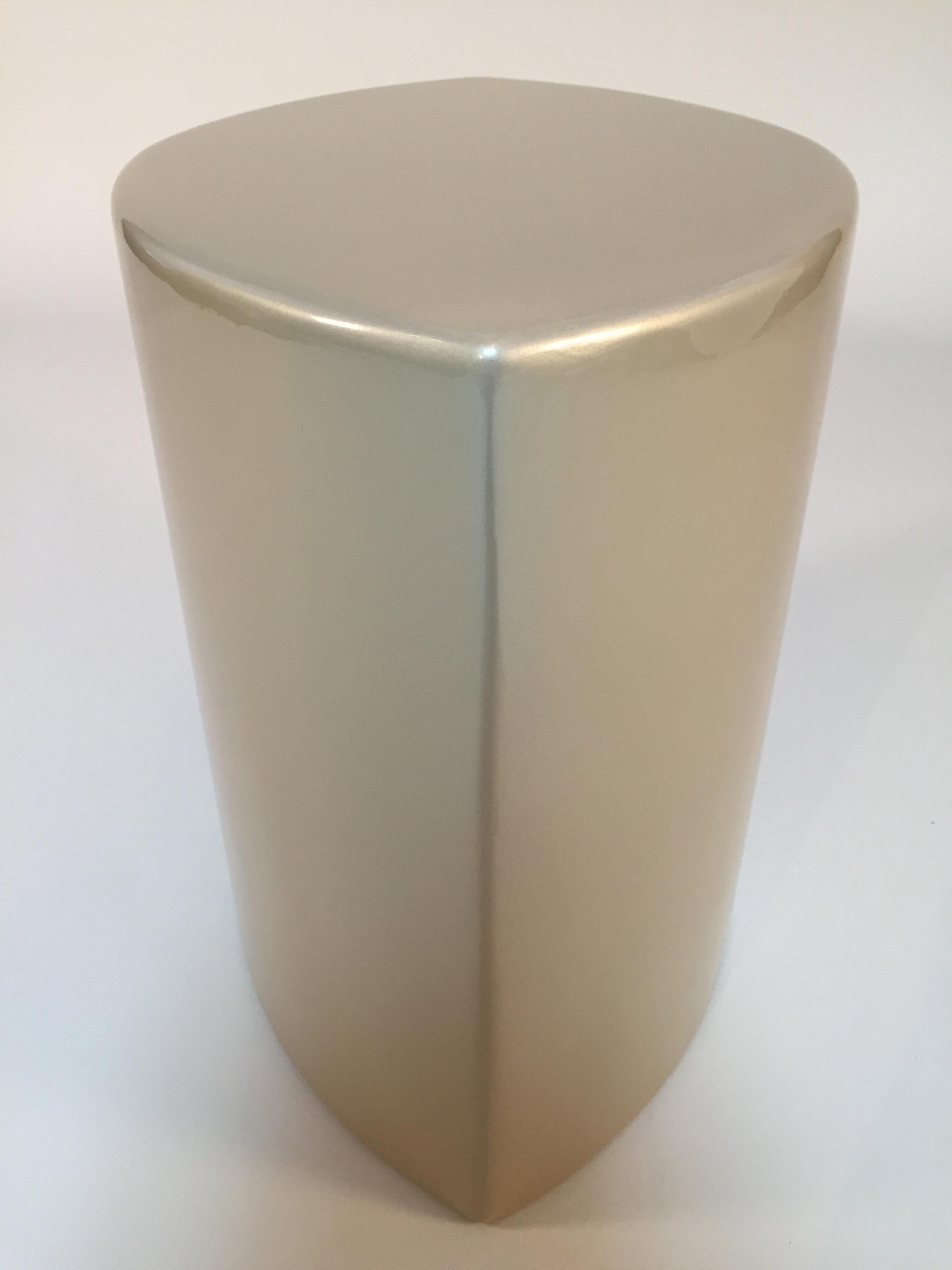 Handcrafted side table or seating by Gabriel M.
A soft organic sculptural form is the base for this finely finished lacquer piece. Brilliant champagne metallic gold give an elegant aesthetic to the softly shaped curves on a multi-use table or seat.