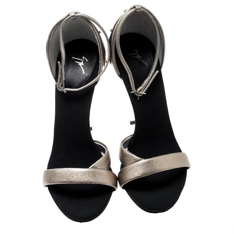 Look glamorous no matter what you wear with these beautiful sandals. They are crafted from metallic gold leather featuring a slender strap at the front and metal-detailed counters. Embrace your unique side when you wear this pair equipped with high