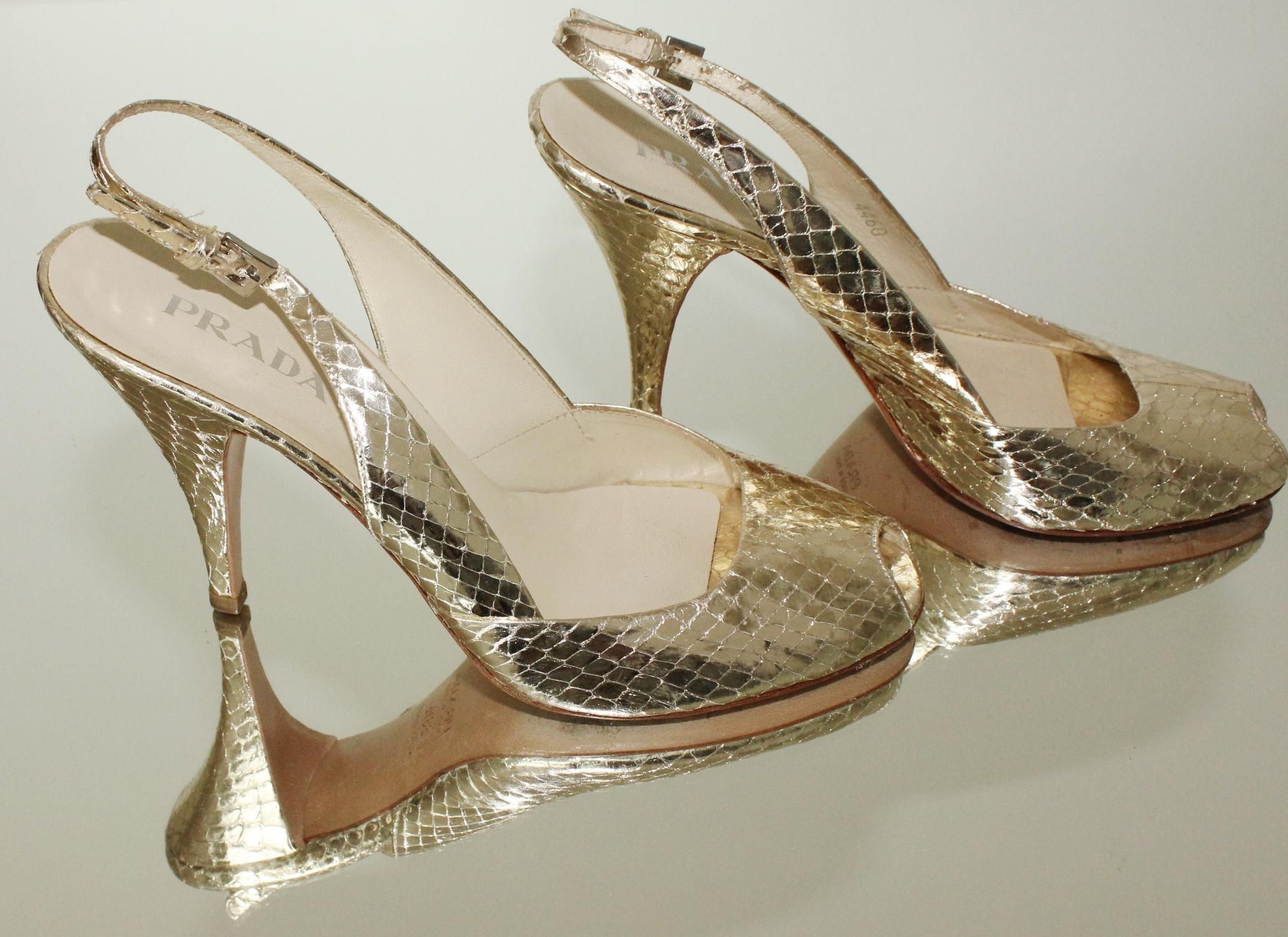 Beautiful peep toe high heels by Prada 
Metallic golden color
Slingback adjustable 
Size 38.5 EU 
Comes with PRADA dustbag 