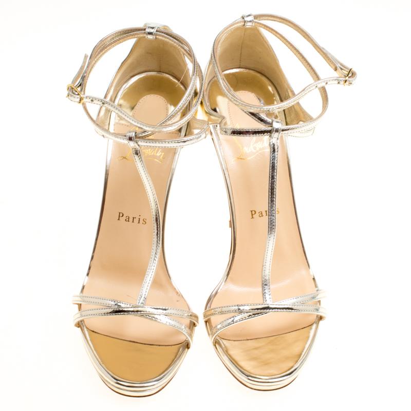 Styled with straps, these light gold Christian Louboutin Benedetta sandals are crafted in leather as a T-strap and completed with buckle closures at the ankles. The gleaming metallic finish, coupled with 12 cm high stiletto heels makes it a pair