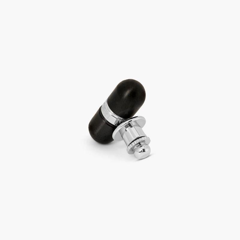 Metallic Pill pin in black IP plated stainless steel

The pill features two tone plating, which is half steel and half IP gunmetal. The pin features a secret compartment; twisting one half of the pill will reveal a secret message. Also available as