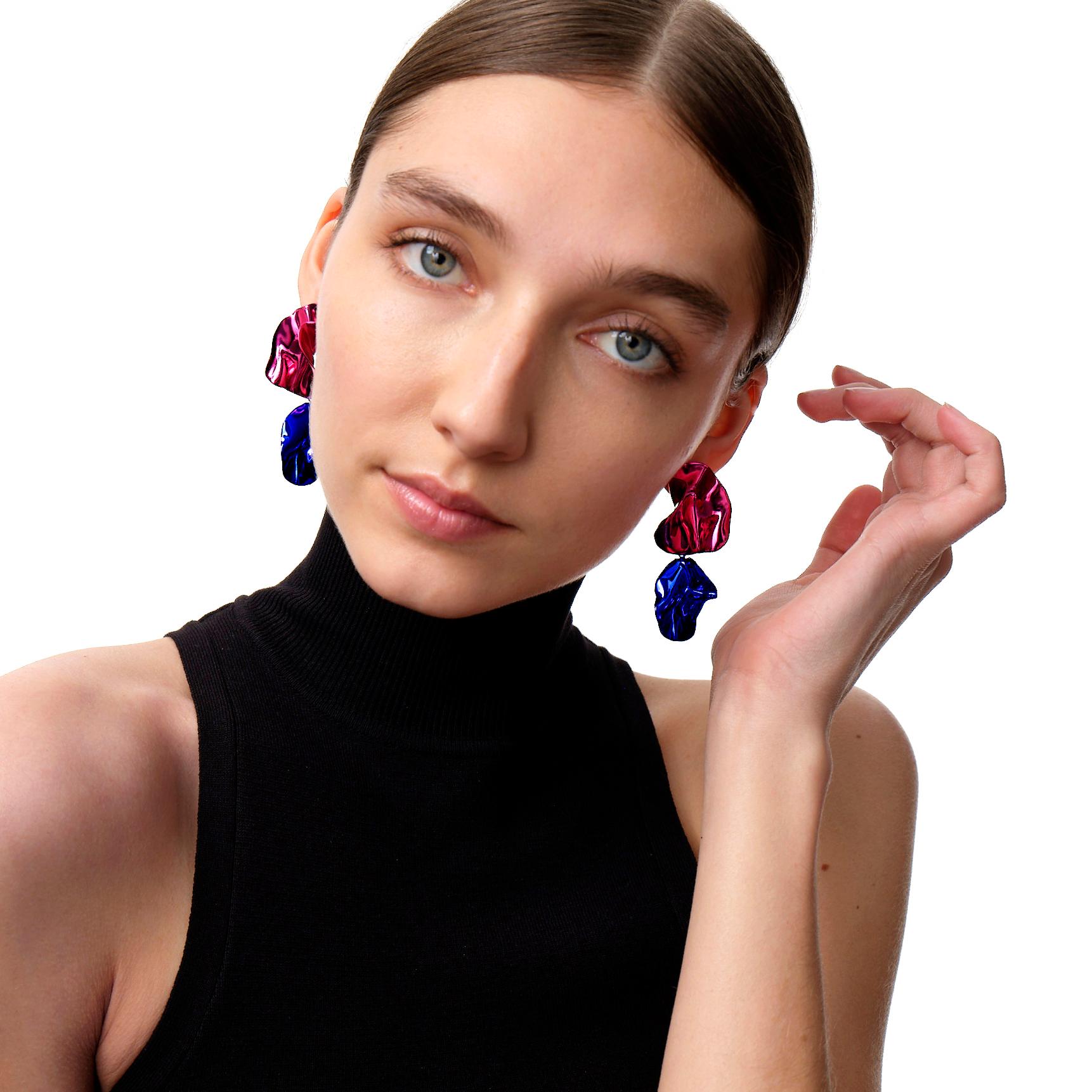 The Fold Earrings are sculptural folded earrings in vibrant metallic Fuchsia and Cobalt Blue. Their intricate folds are highlighted by the high-polished Mirror Finish. Wear them for a pop of color this fall.

Ceramic coated
Sterling silver post and
