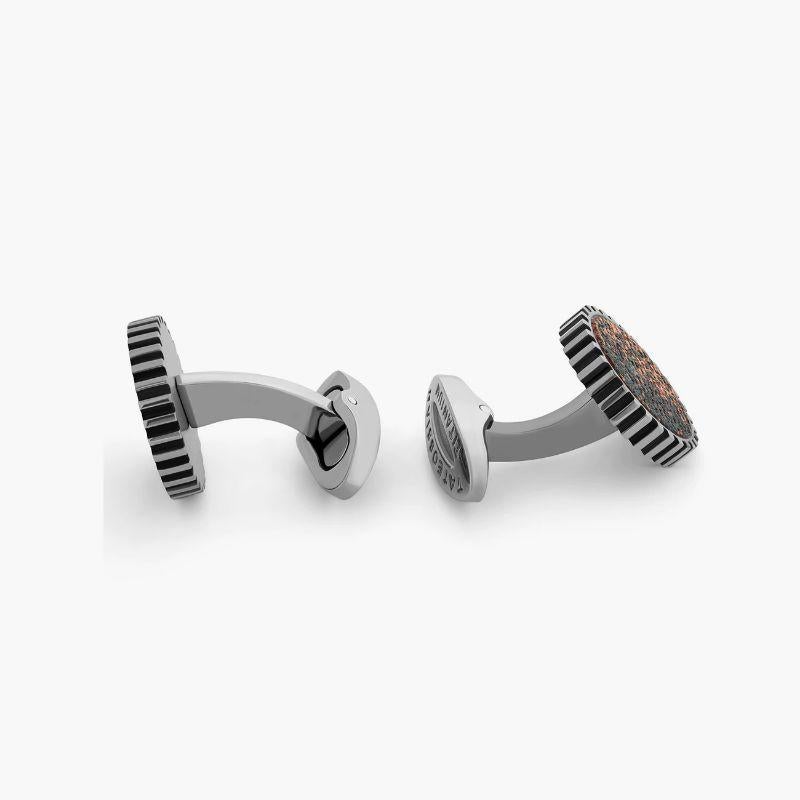 Metallic Rose Art Gear Cufflinks

Light-weight and masculine, titanium lends itself naturally to creative design. Titanium as a material has a low density and high strength. It is highly resistant to corrosion. Titanium is often used in the