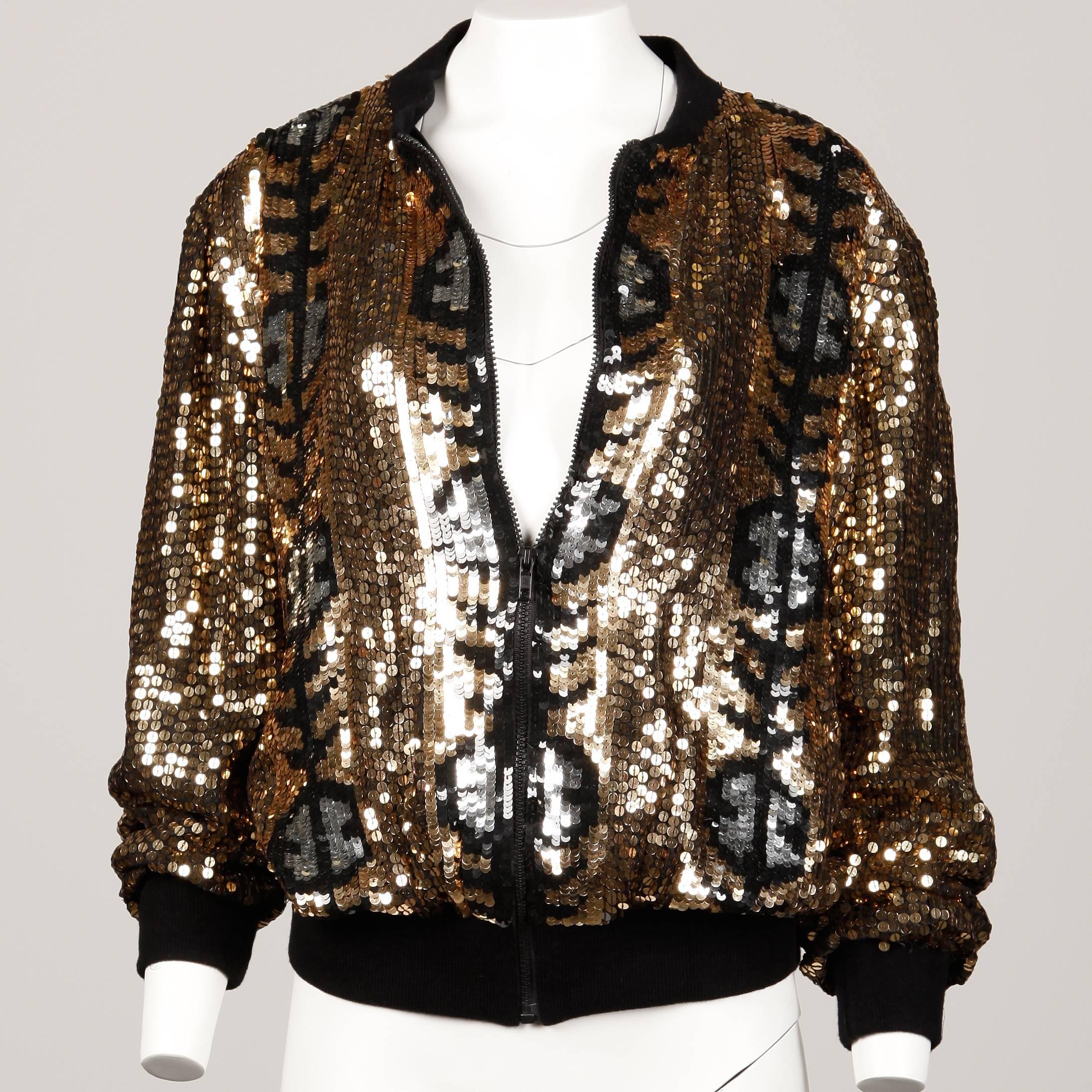 Unworn with the original store tags attached! Vintage sequin bomber jacket with ribbed cuffs and waistband and zip up front. The jacket is 100% silk with polyester lining. The marked size is a large but the jacket should fit sizes small-medium as