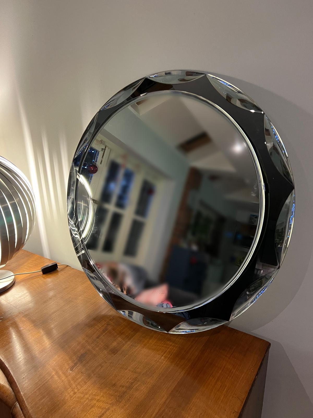 Metalvetro, Wall mirror, circa 1960, Mirrored glass, chromed steel, Partial manufacturer's label to reverse, 72cm diameter.

Unique with raised interior circle (see images).