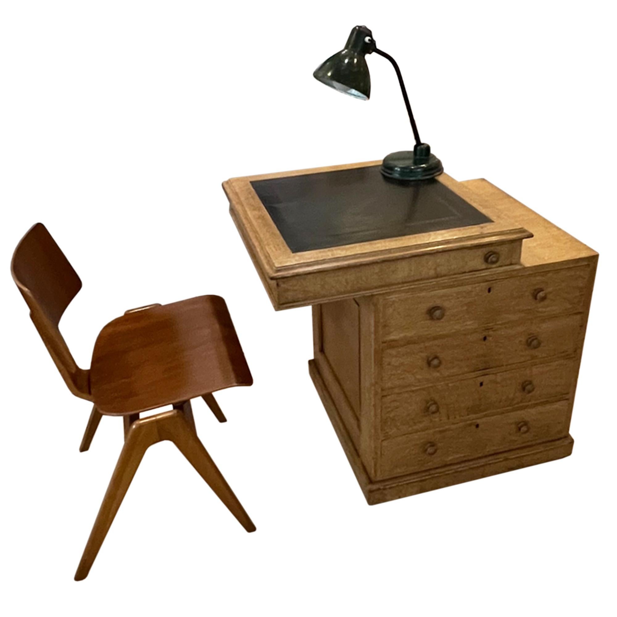This ingenious desk was made in Britain around 1900. We love the secret drawer for stationary and the 4 main drawers provide ample storage. The handles and key holes on the opposite side are purely decorative.

As you can see the leather top can