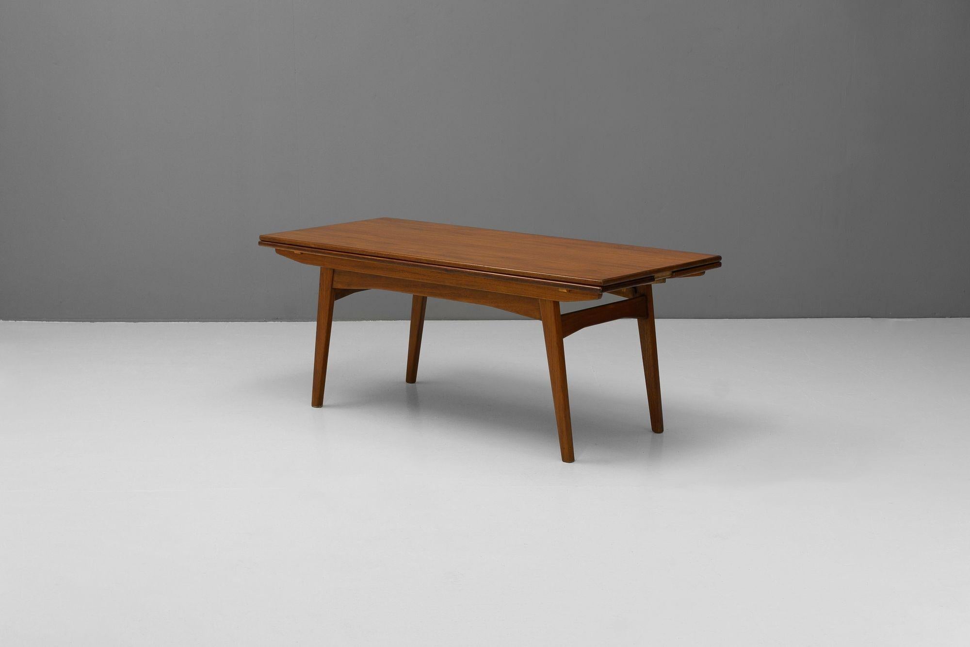 Fabulous metamorphic coffee/dining table in teak. Extended dimensions - H 70cm x W 141cm x D 112cm. U.K circa 1960.


H 57cm x W 141cm x D 60cm