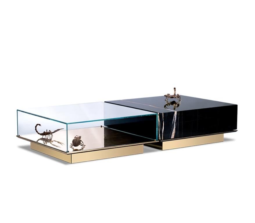 Modern Metamorphosis In Marble And Glass Center Table By Boca do Lobo

A Modern Metamorphosis in Marble and Glass Center Table by Boca do Lobo, this is a set of two tables, one module is composed of a glass box that envelopes 3 gold plated elements