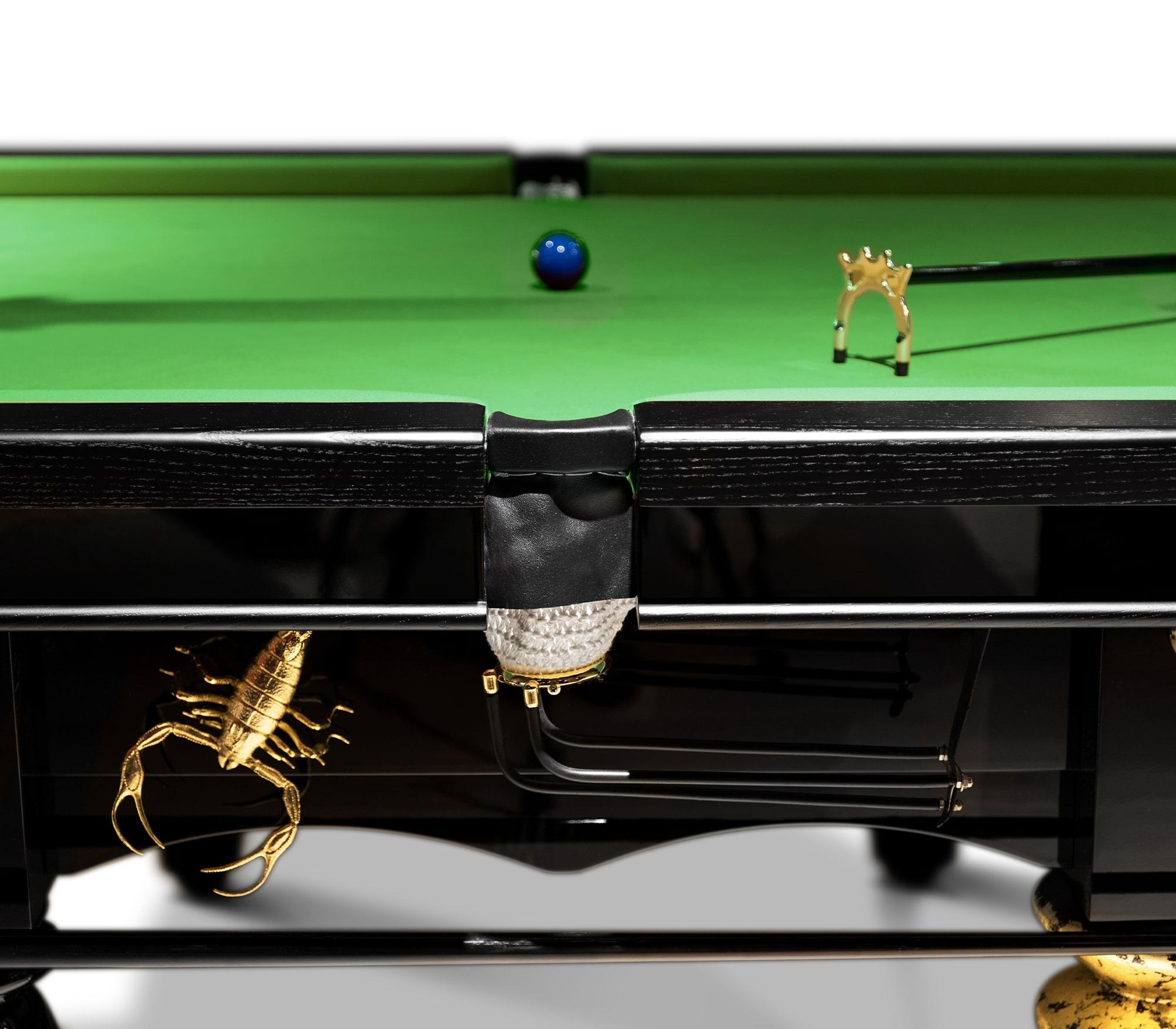 A playful and remarkable design imagined for those who appreciate the good things in life, finding beauty in the most unexpected places. An extraordinary English snooker table of 10 foot playground, founded by 8 statement designed black wood legs