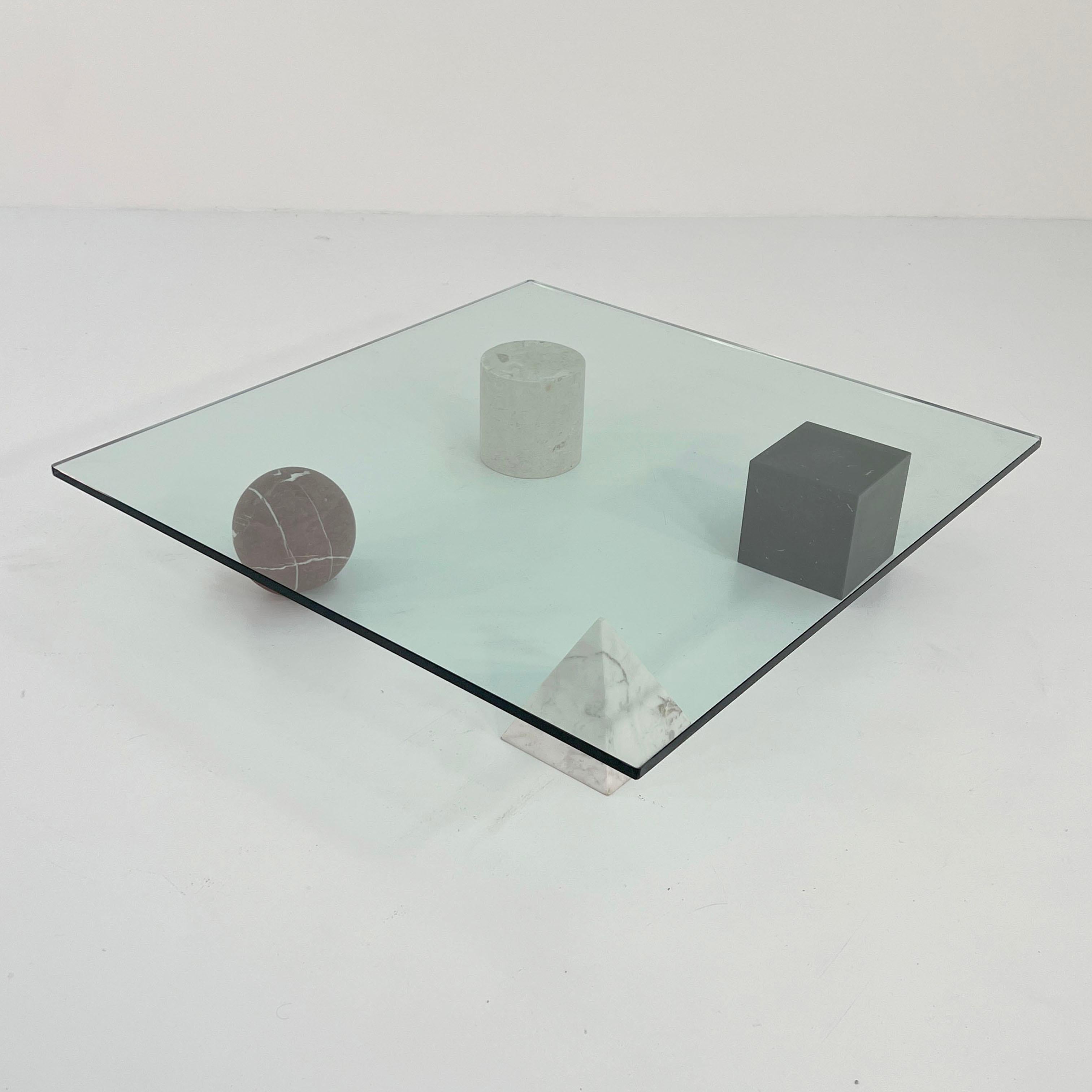 Designer - Lella & Massimo Vignelli
Producer - Casigliani
Model - Metaphora Coffee Table
Design Period - Seventies
Measurements - Width 120 cm x Depth 120 cm x Height 22 cm
Materials - Marble, Glass, Travertine
Color - Clear, White, Black, Beige