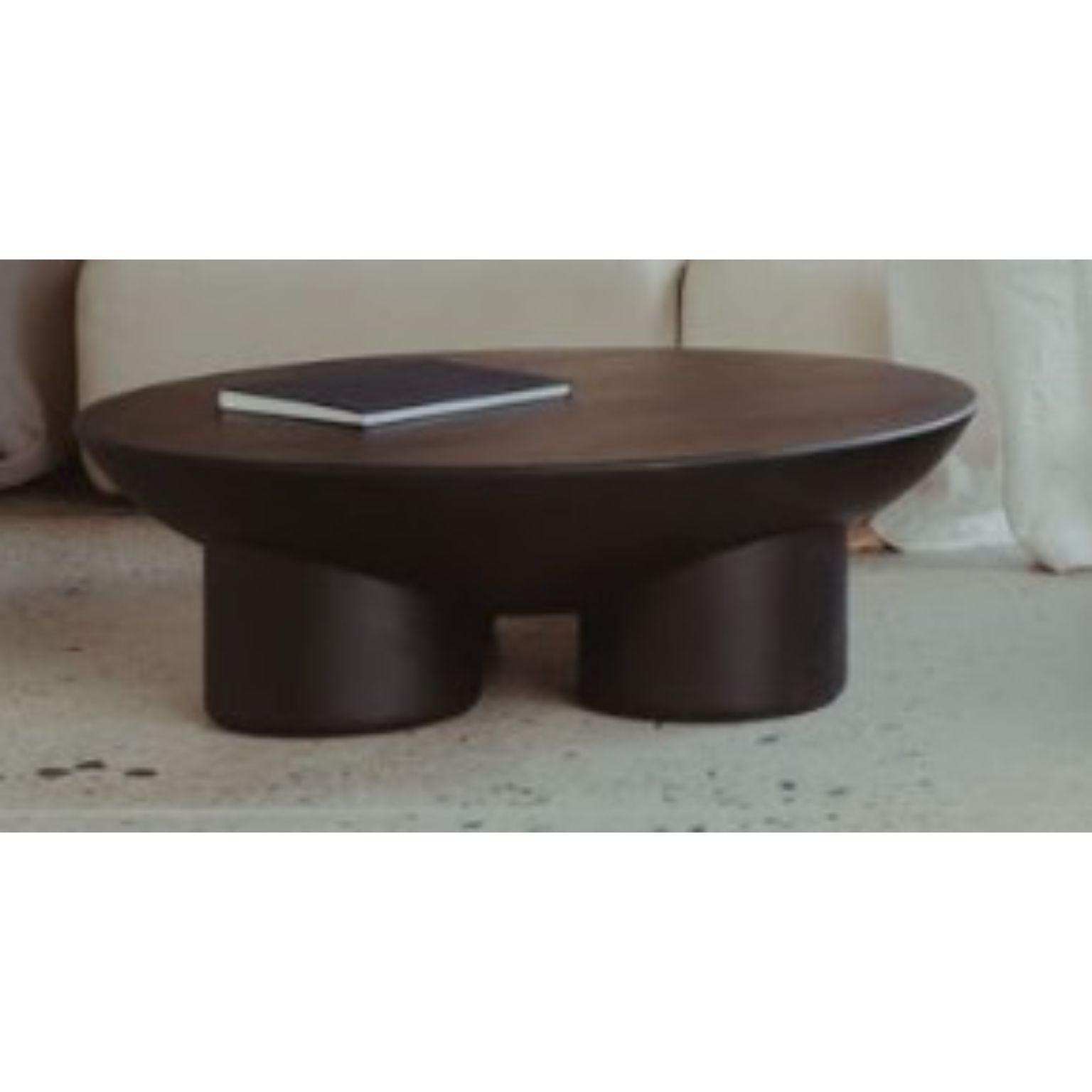 Metate Black Wood Coffee Table by David Del Valle
Dimensions: D 100 x W 100 x H 30 cm.
Materials: Black wood.

DAVID VALLE
We are a place, a space, a woven chair, the dreams of a craftsman, the pride of a worker, we are a way of thinking, we are