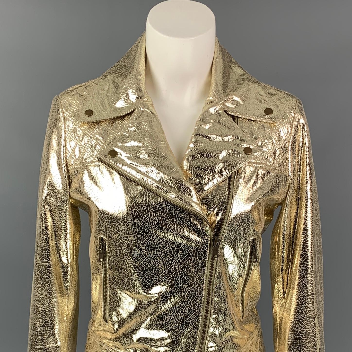 METEO jacket comes in a gold metallic leather with a full liner featuring a biker style, zipper sleeves, snap button details, zipper pockets, and a zip up closure. 

Very Good Pre-Owned Condition.
Marked: 38

Measurements:

Shoulder: 15.5 in.
Bust: