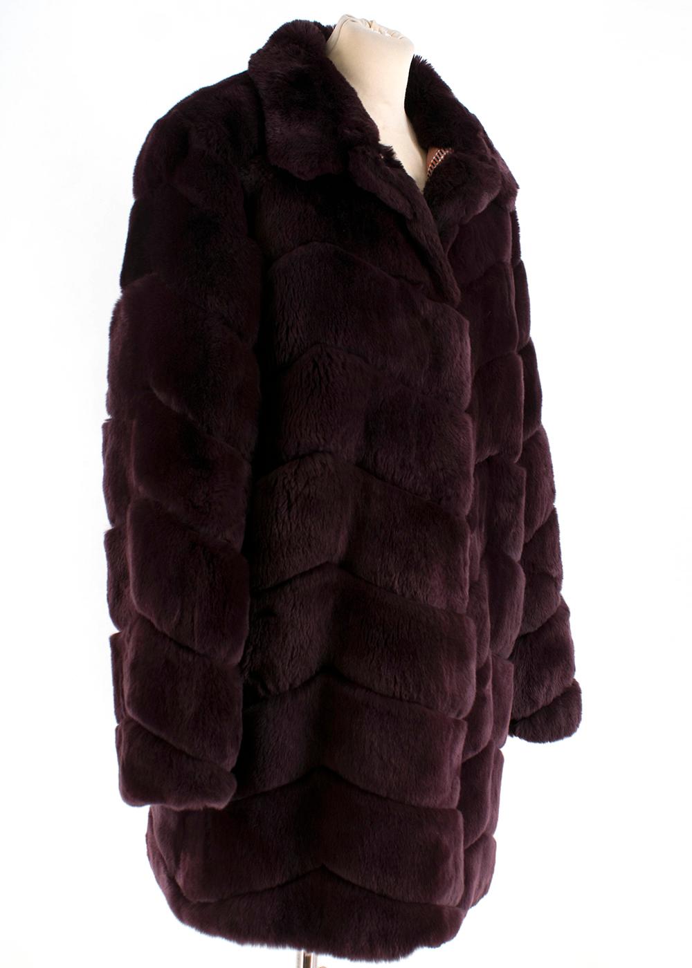 Yves Salomon burgundy rabbit fur coat perfect for the winter days.  RRP £2700

- Button fastening
- Collar
- Two side pockets
- Mid length

Please note, these items are pre-owned and may show signs of being stored even when unworn and unused. This