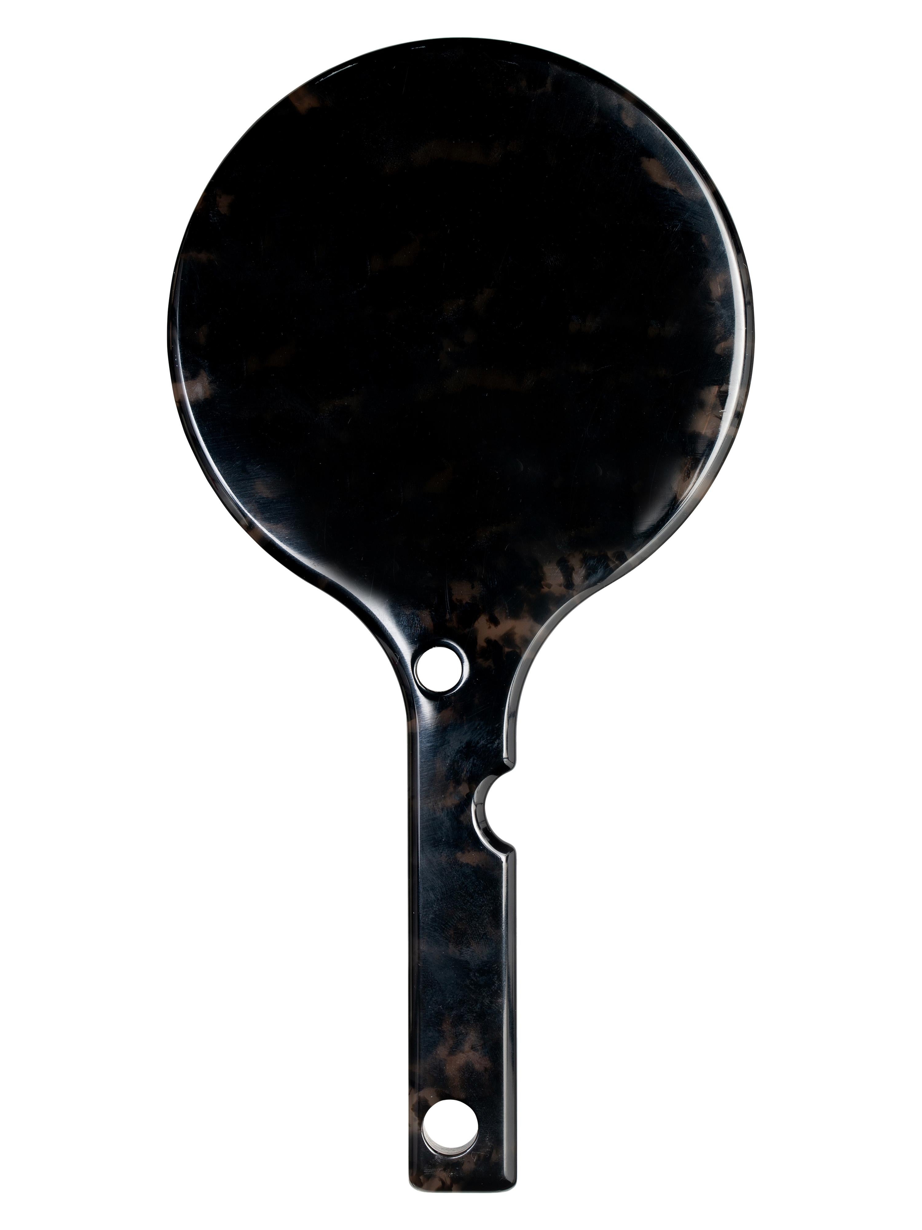 Round Hand mirror with Havana black and brown marble acetate body. Handle is holed with man swimming logo gold impressed.
By Virgil Abloh
Dimensions: 10.7 W x 21 H
This item is only available to be purchased and shipped to the United States.