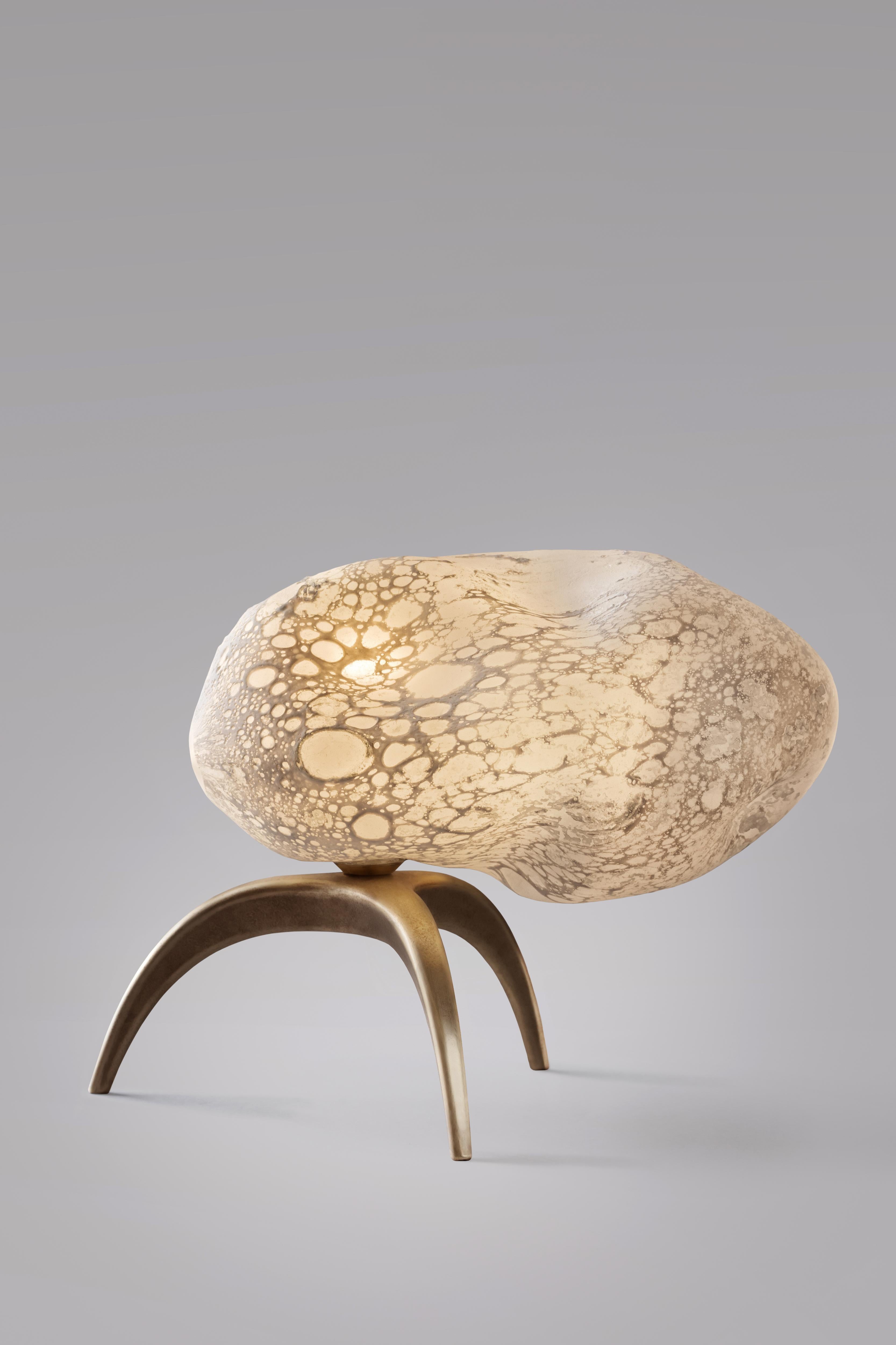 Meteore sculpted table lamp - Ludovic Clément d’Armont.
Material: blown glass and brass.
Dimensions: 20 x 25 x 15 cm.

Ludovic Clément d’Armont is in the continuation of a family tradition of centuries of gentle glassmakers, painters, carpenters