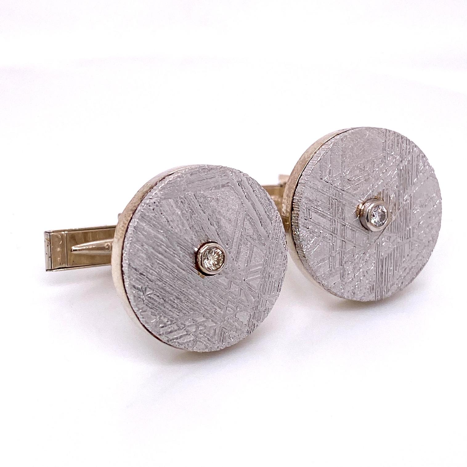 A pair of circle meteorite cufflinks with sterling silver and 18k white gold, set with .12ctw of diamonds. These cufflinks were made and designed by llyn strong.