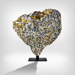 Meteorite Cross Section with Amber-Coloured Peridot Gems and Metal Matrix