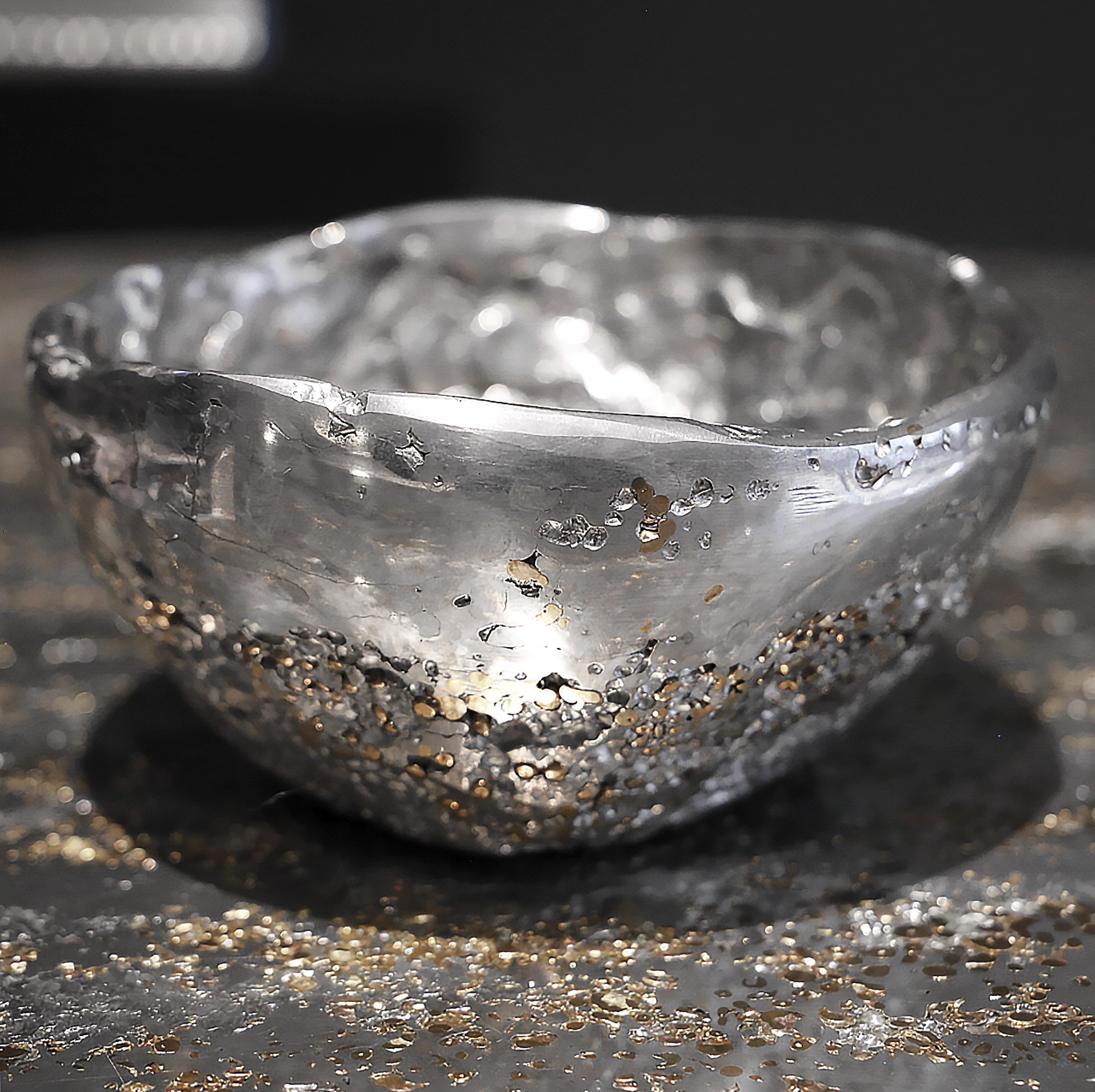 In stock. This contemporary cup is a unique piece, created by Xavier Lavergne and made of melted pewter with brass grains. It seems like a Meteorite discovered in the sand. Handmade in France and sold with its “Certificate of Authenticity”, this