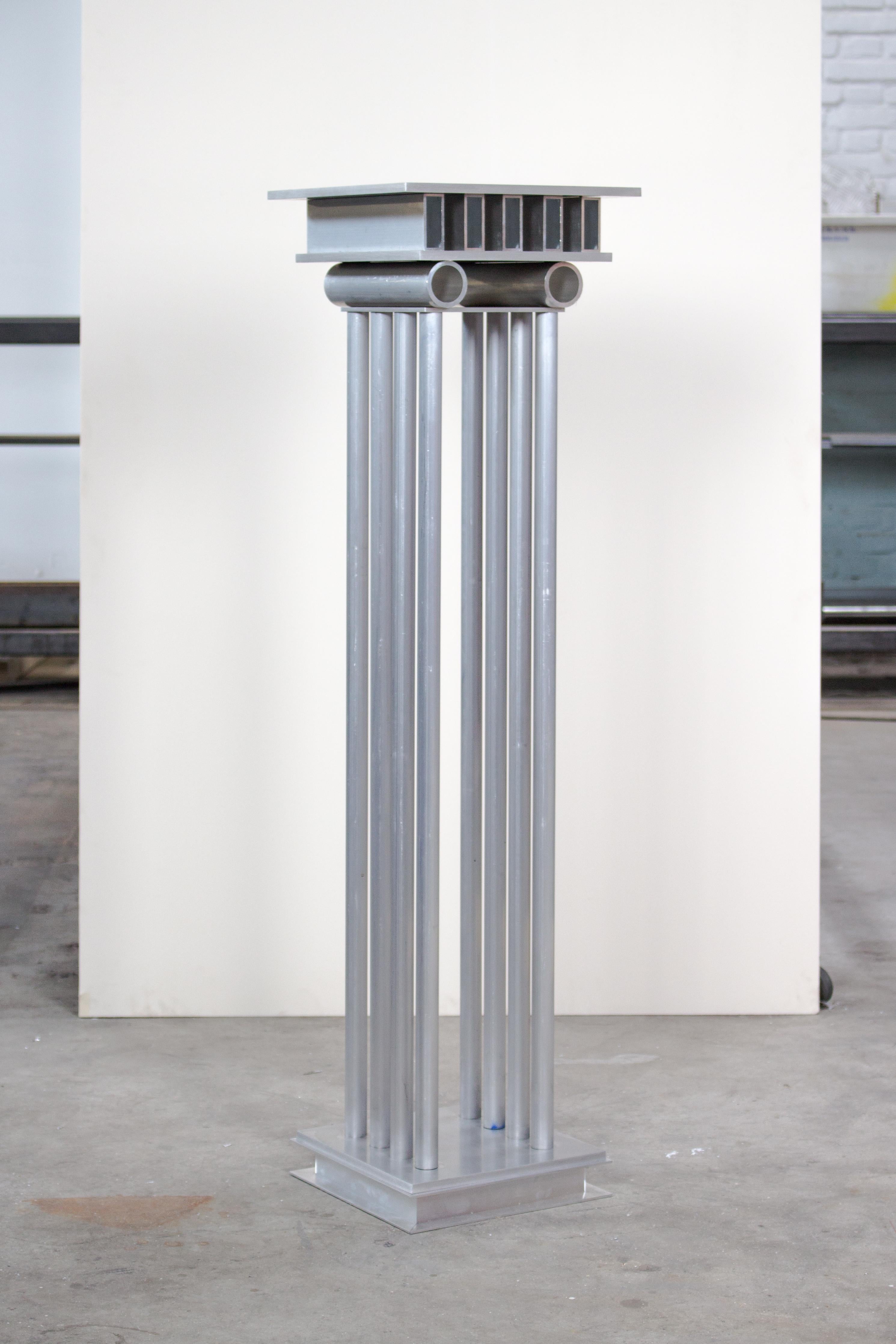 Metope Column by Joachim-Morineau Studio
Dimensions: H 110 x D 30 x W 30 cm, 18 kg
Materials: Aluminium tubes, profiles, screws and sheets
Possibility to have a different colour/finish (such as blasted or anodized aluminium).

THOLOS, PTERON