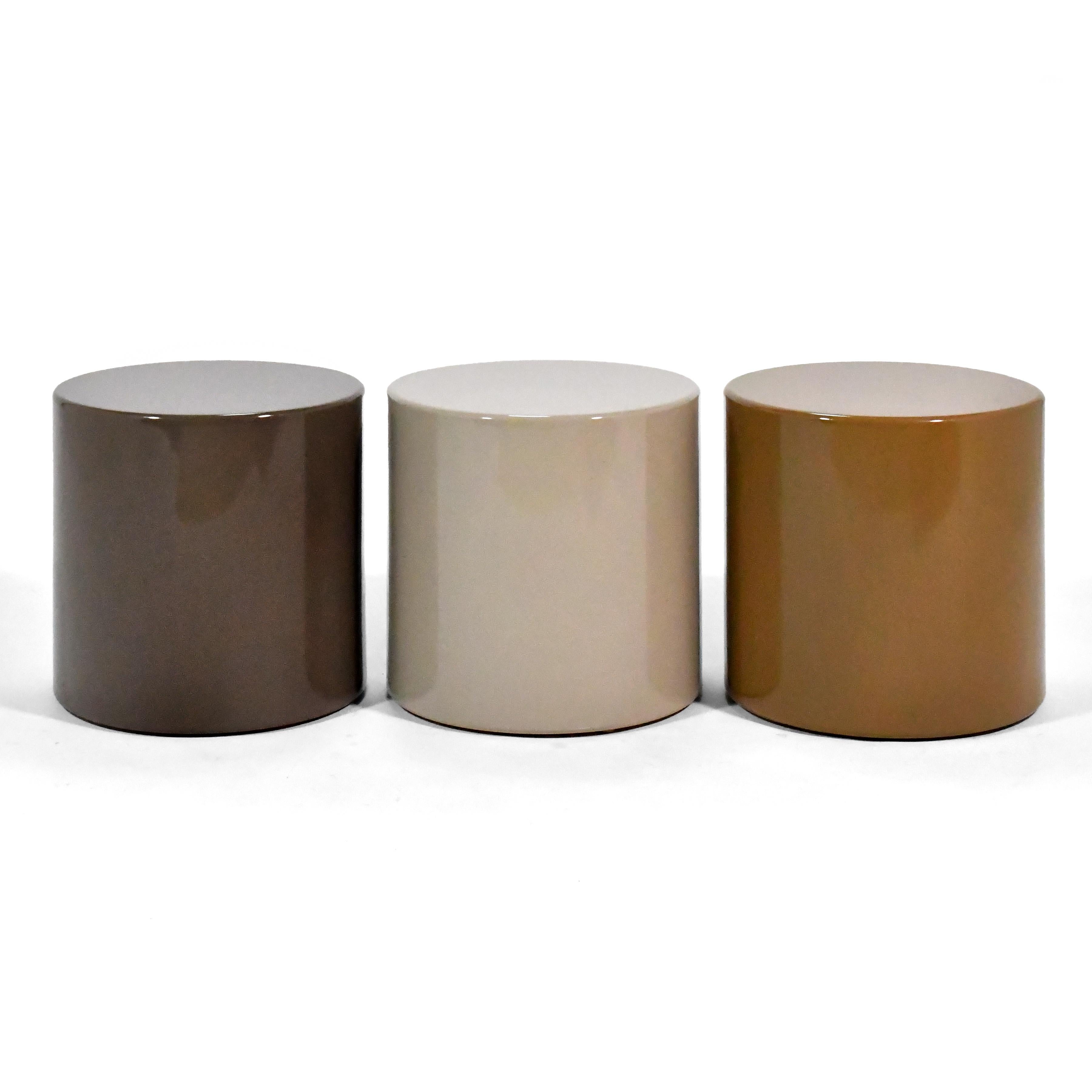 These minimalist, cylindrical tables by Metro are finished in a beautiful muted palate of Gray, Taupe and Cider Brown. They can be used individually or as a grouping, and are sturdy enough that they could be used as stools.

16.25”h X 15.75”d.