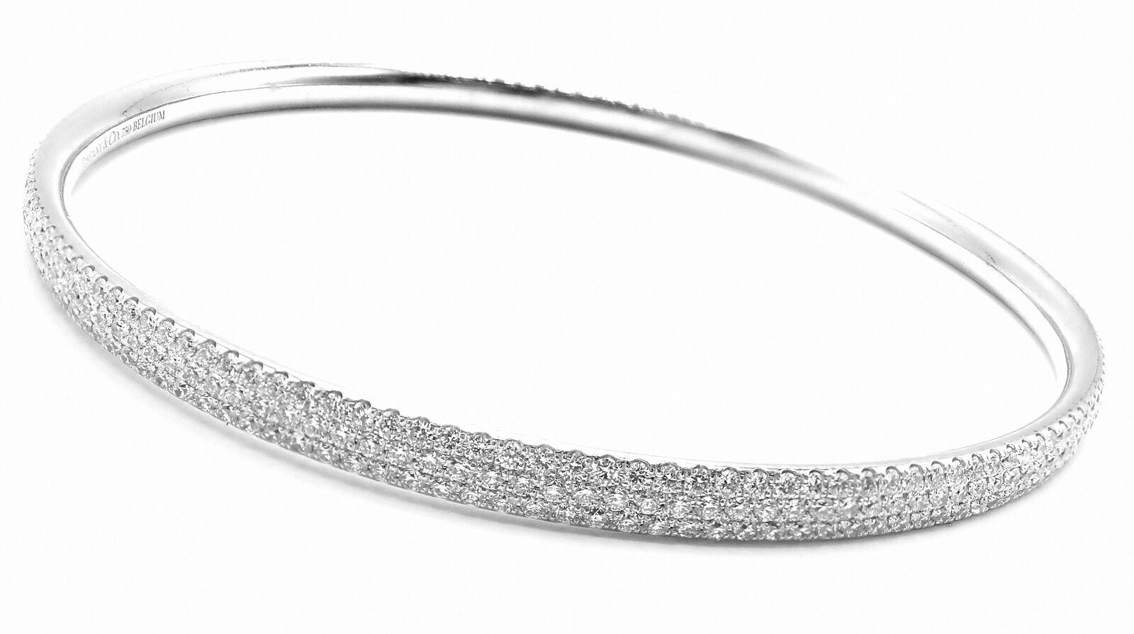 18k White Gold Full Diamond Three-Row Slip On Metro Bangle Bracelet by Tiffany & Co. 
With Round Brilliant Cut Diamonds VS1 clarity, G color 2.98ct
This gorgeous bracelet come with an original Tiffany & Co box.
Details: 
Size: Medium 6.25