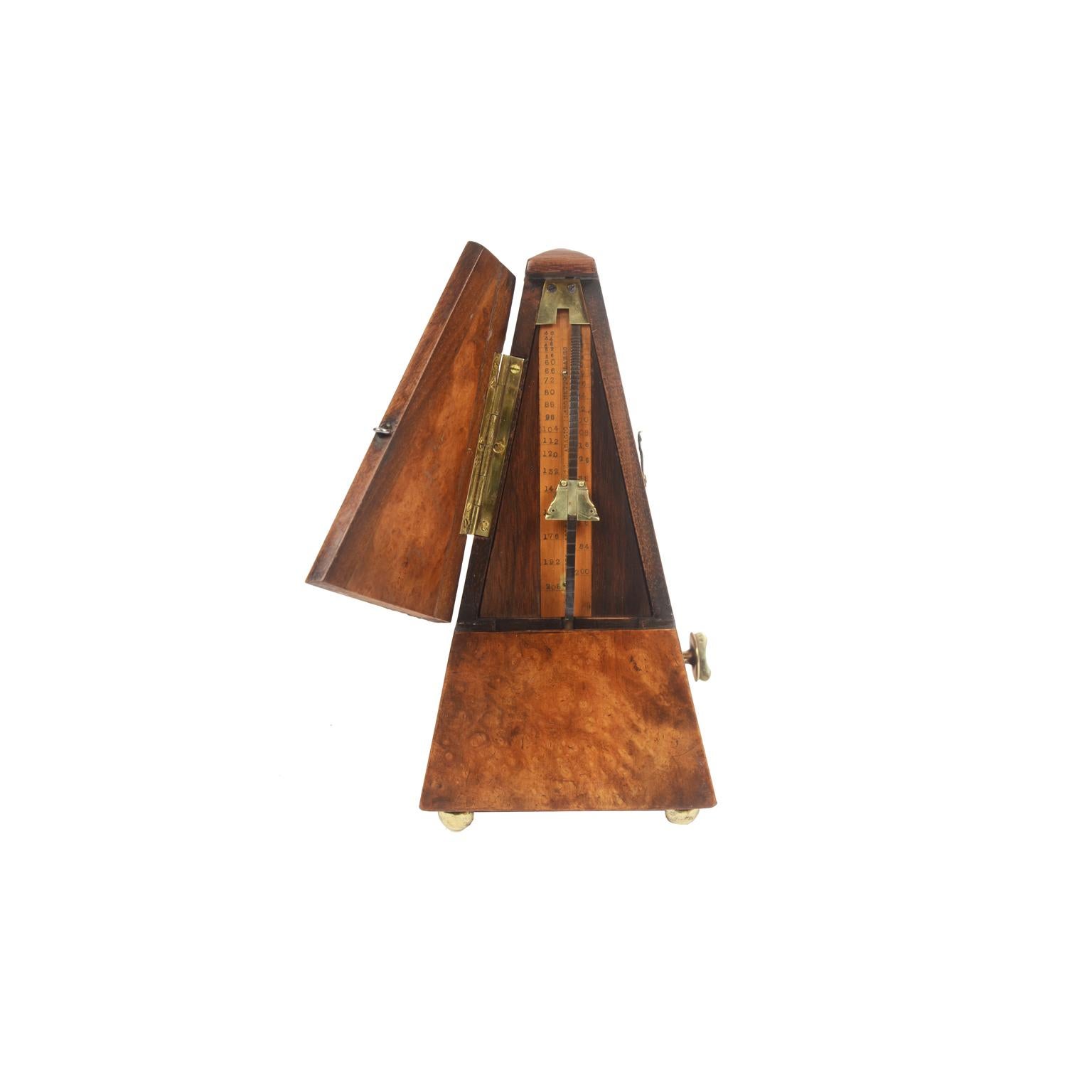 Metronome made in the late 19th century. It is an instrument used to measure the Tempo of music, the sound of the pendulum indicates the exact speed of execution. The instrument consists of a pendulum with a counterweight that works with a clockwork
