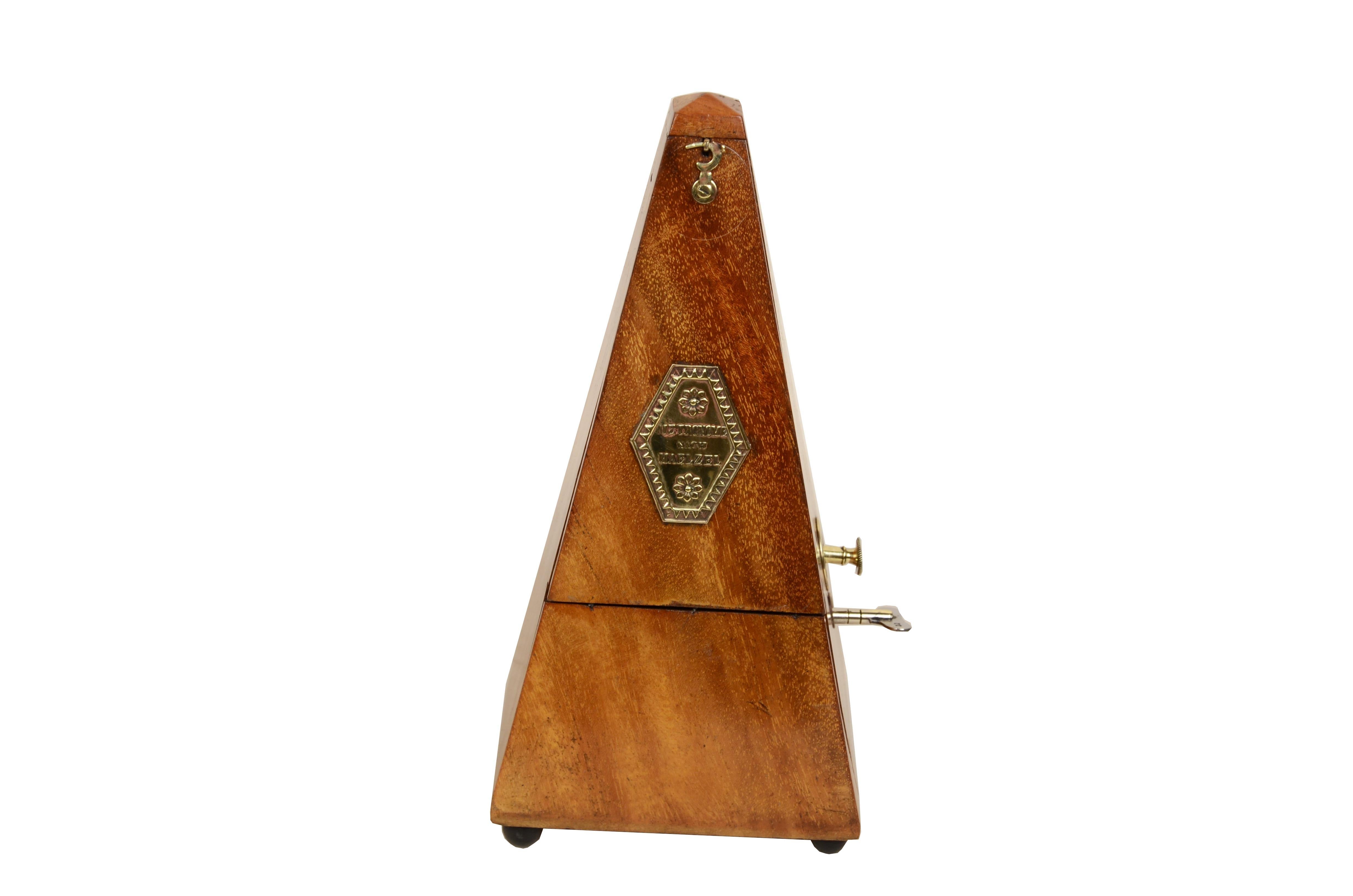 Metronome system  Johan Maelzel (1772-1838) from the early 1900s. This is an instrument used to measure the tempo of music; the sound of the pendulum accurately signals the speed of performance.  The instrument consists of a pendulum with a