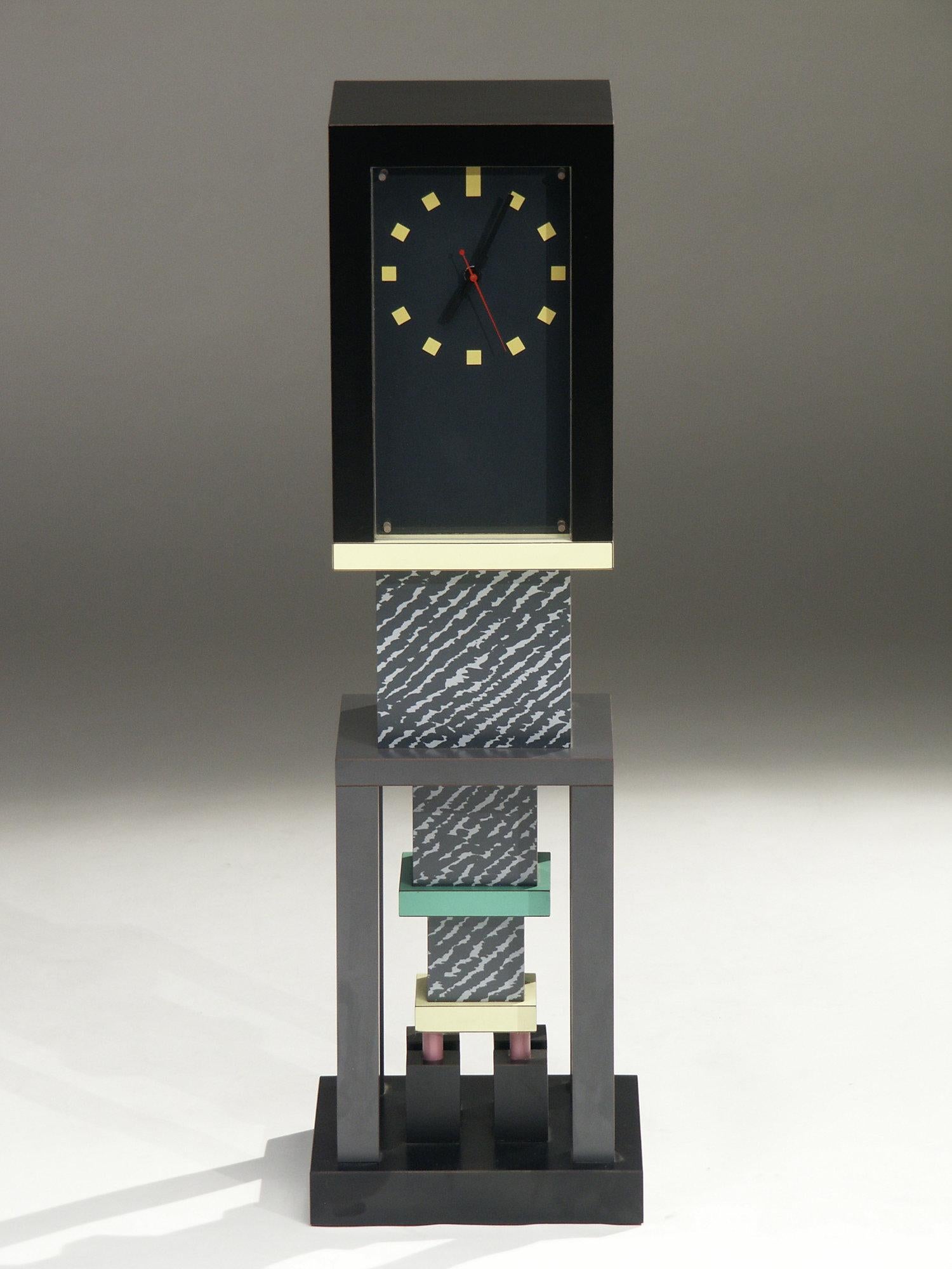 Clock made of lacquered wood and covered in decorative laminate. 
By George J. Sowden for Memphis Milano. 