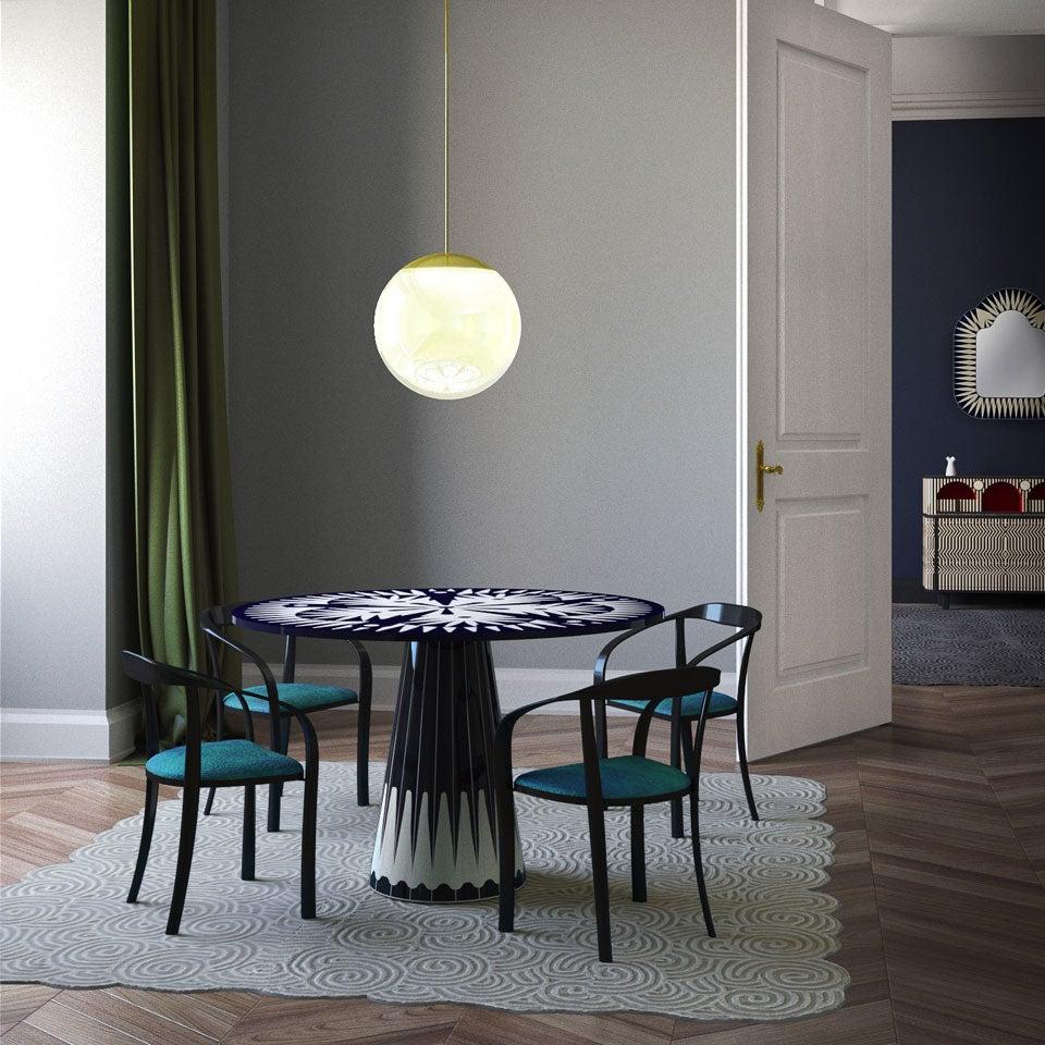 Metropolis Marquetry Dining Table by Matteo Cibic is a beautiful dining/breakfast table for four with a circular top. It is available in a range of patterns and the colours can be customised according to specifications.

India's handicrafts are as