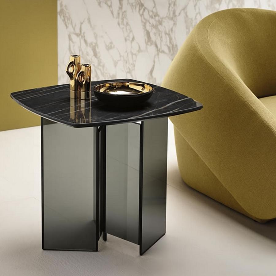 The side table or bed side table is part of a furniture collection characterized by a base in extra clear or smoked glass.
The table tops are in the 3 new polished finishes in ceramic+glass with marble effect.

Designed by Giuseppe Maurizio
