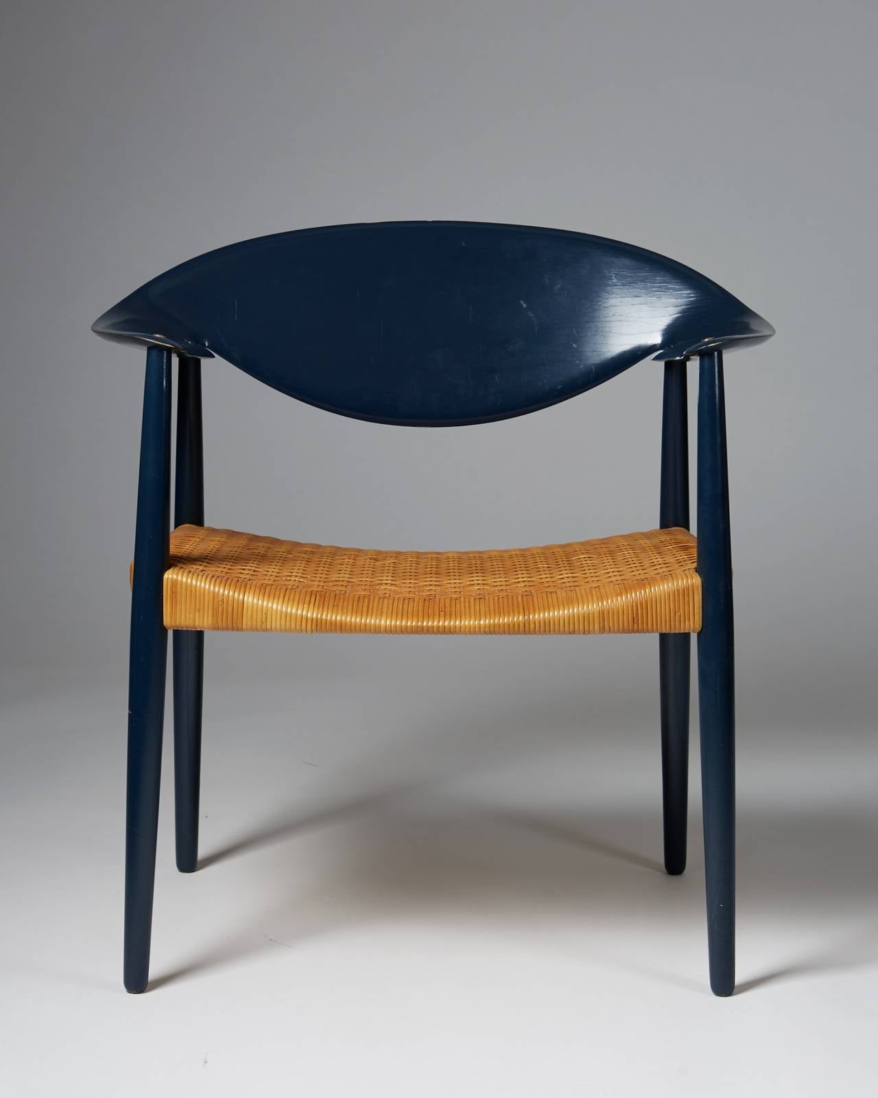 Armchair Metropolitan designed by Aksel Bender Madsen and Ejner Larsen for Willy Beck,
Denmark. 1950s.

Lacquered wood and original cane.

Dimensions:
H: 78 cm/ 2' 7''
D: 50 cm/ 1' 8''
W: 76 cm/ 2' 6 1/4''
SH: 40 cm/ 1' 4''
Arm rest: 6.5 cm/ 2' 3''
 