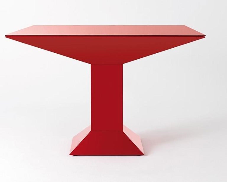 Metsass table designed by Ettore Sottsass Jr. for BD Barcelona. The structure is made of flat sheets of steel, painted in red. The glass top is painted in the same color as the base. In the 1970s, Sottsass created many designs for BD Barcelona. One