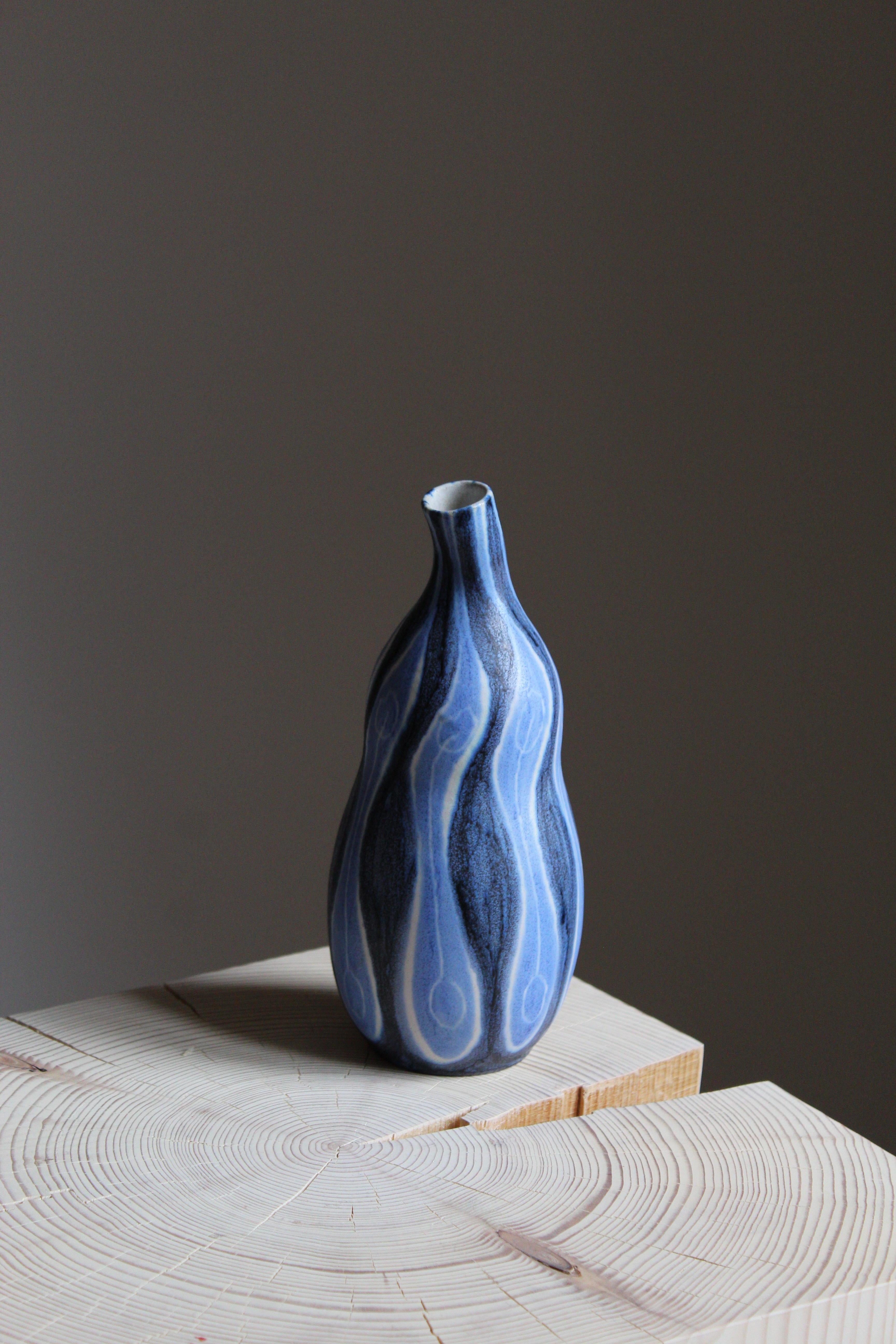 A stoneware vase produced by Andersson & Johansson Höganäs, Sweden, circa 1960s. Design attributed to Mette Doller.

 