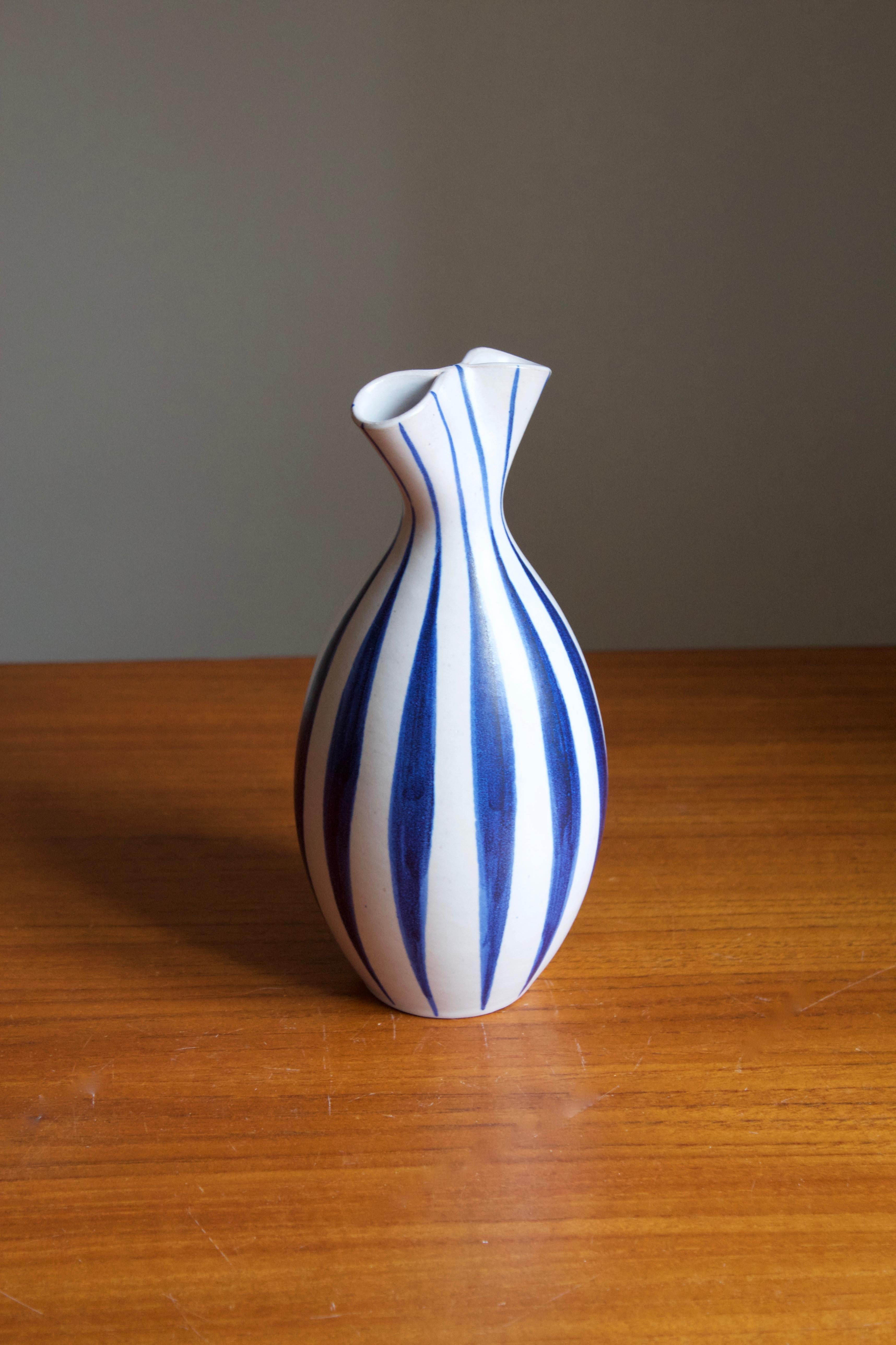 A stoneware vase produced by Andersson & Johansson Höganäs, Sweden, circa 1960s. Designed by Mette Doller.

 