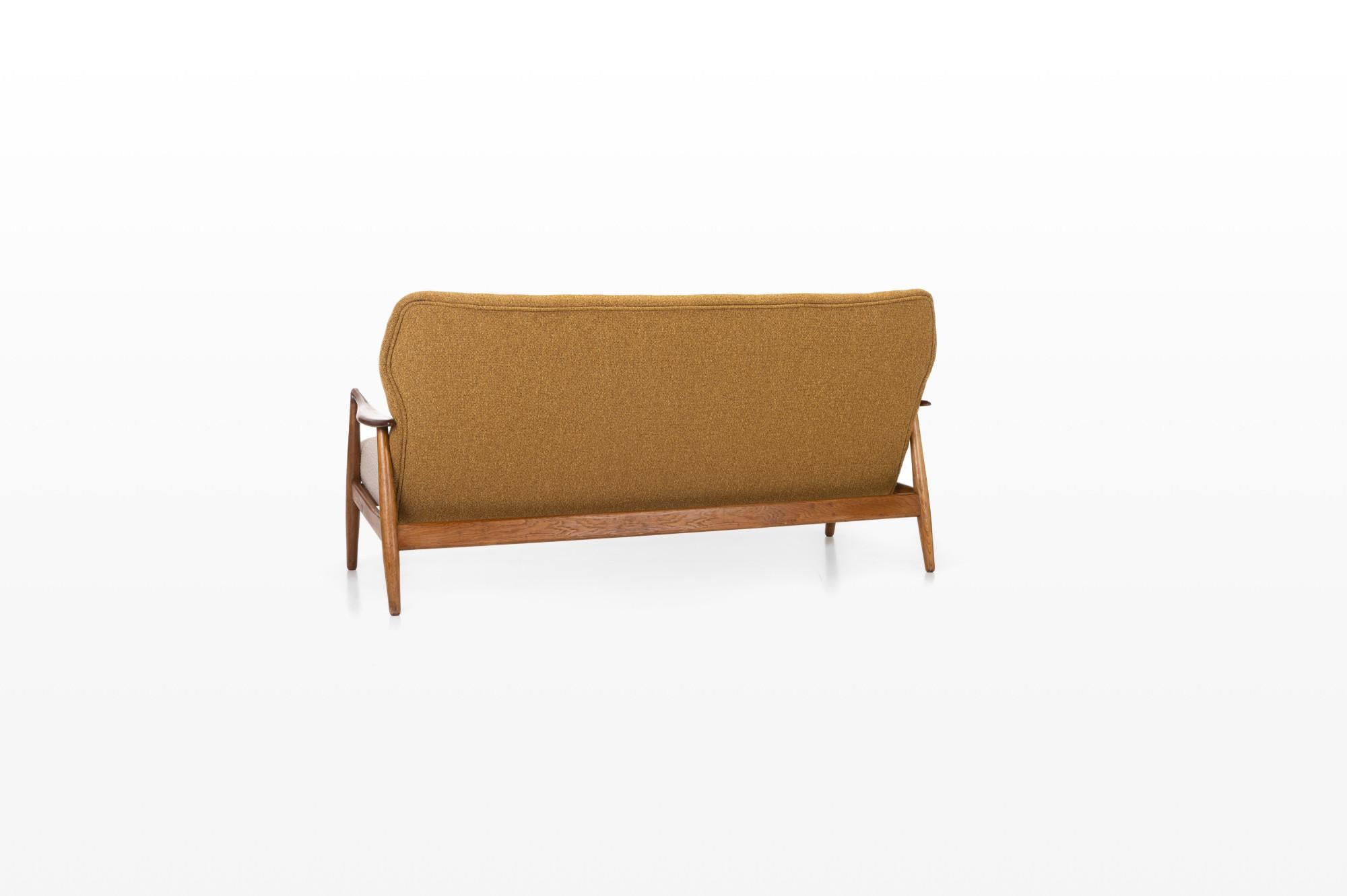 Mette' sofa designed by Arnold Madsen & Henry Schubell for Bovenkamp, Netherlands 1950s. The sofa is made of teak and oak. The sofa has been completely renovated and reupholstered with an ocher yellow and cream beige fabric.