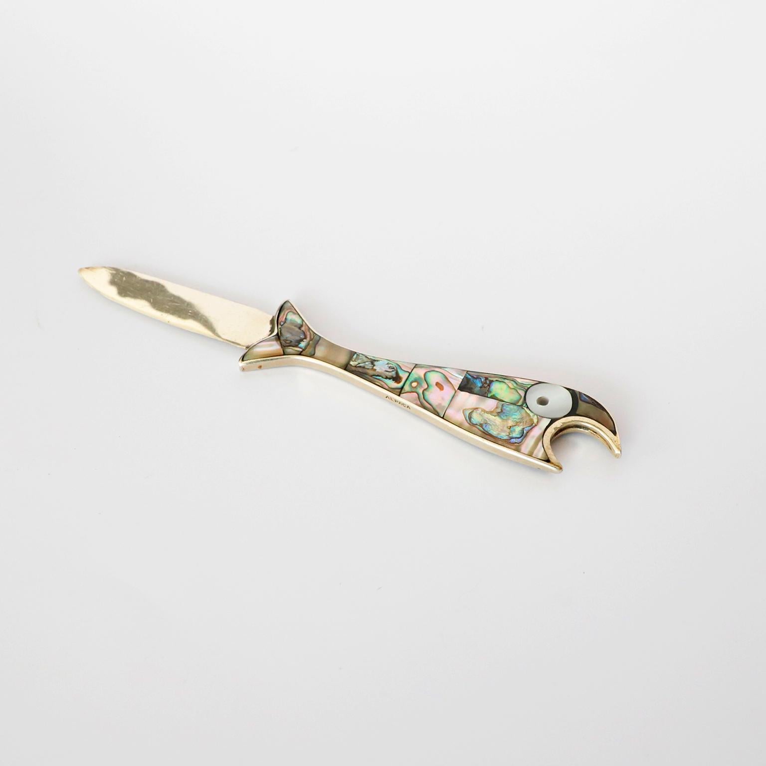 Beautiful vintage Mexican abalone shell and iron bottle opener in the form of fish.