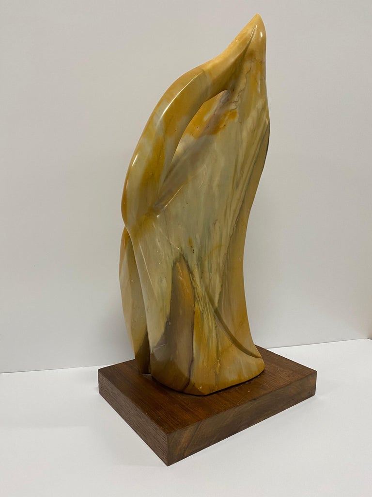 Carved Mexican amber onyx flame sculpture by Renaissance Man, Anthony Gennarelli. Sculptor, painter, musician and teacher; Gennarelli composed and sculpted in his home in Orange County, New York. He produced a Fine body of work that is now in