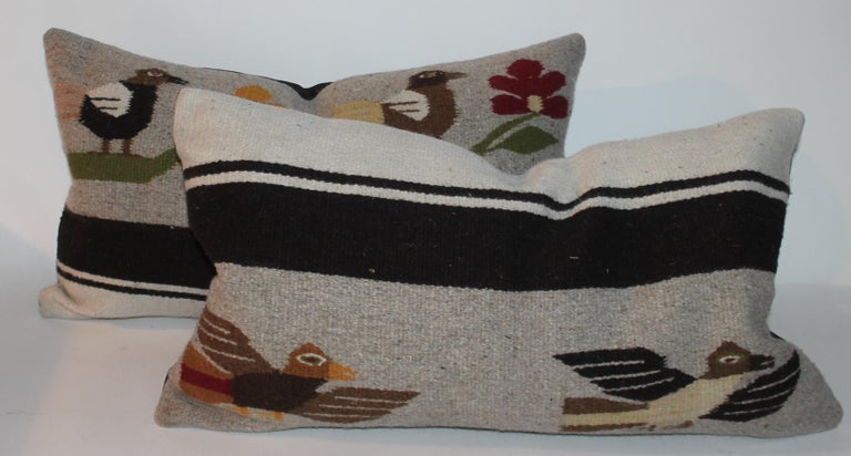 Mexican Indian weaving pillows with black linen backings. In very good condition. Sold as a pair.