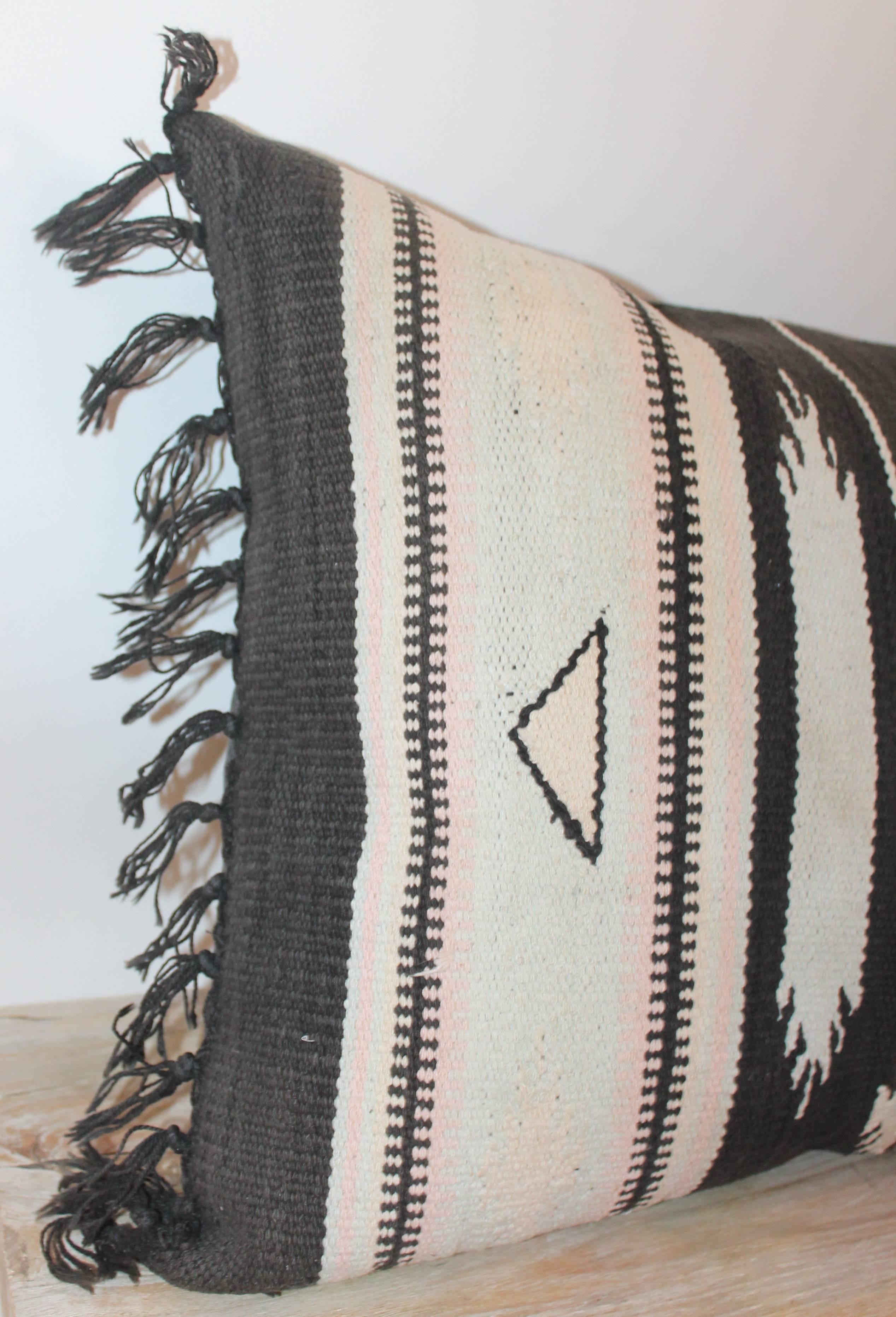 This fine Mexican / American Indian weaving bolster pillow has the original fringe and is in great condition. The backing is in black cotton linen.