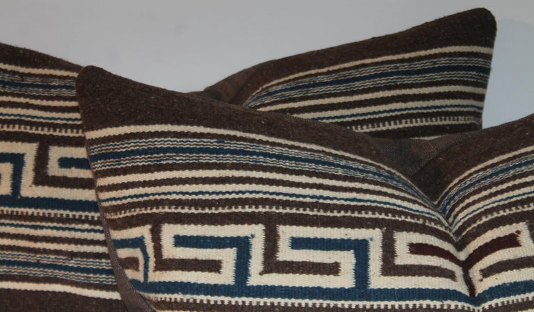 These amazing Greek key striped Indian weaving bolster pillows have a thick coco cotton linen backing. The condition is pristine. They are down & feather fill inserts. Sold as a pair.