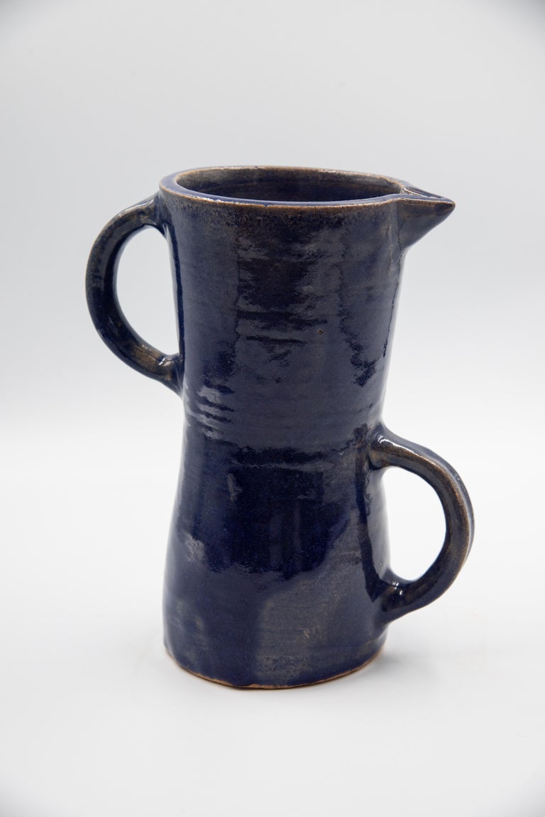 This beautiful rustic pottery pitcher is made by Rolando Regino Porras, son of famous Mexican potter Dolores Porras, in Santa Maria Atzompa, in the state of Oaxaca, Mexico. Dolores made a great innovation by converting a utilitarian object at that